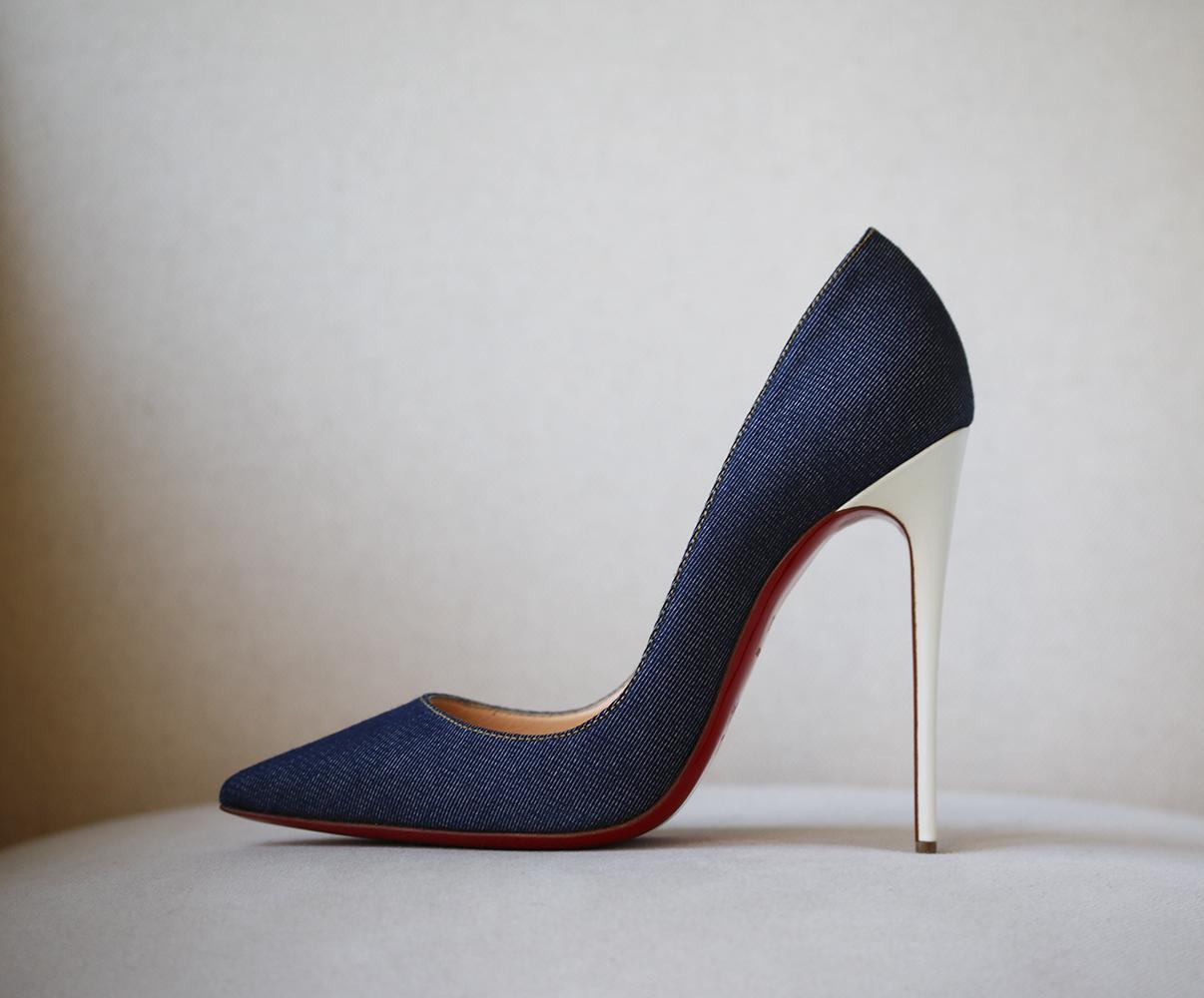 One of Christian Louboutin's most notable designs, the 'So Kate' pumps are lauded for their high pitch and streamlined silhouette. This dark-blue denim version has a white patent leather-covered heel that adds to the cool, contemporary look. Heel