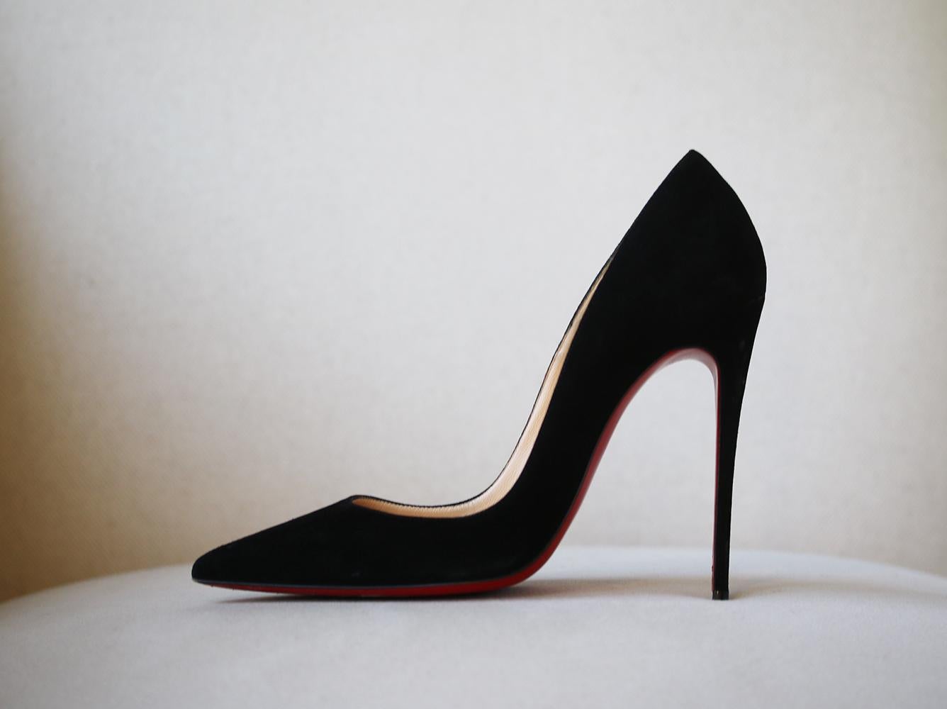 Christian Louboutin's iconic 'So Kate' pumps are defined by their pointed toe and thin stiletto heel. This Italian-made pair is crafted from black suede cut with a leg-lengthening low vamp and finished with the label's signature lacquered red soles.