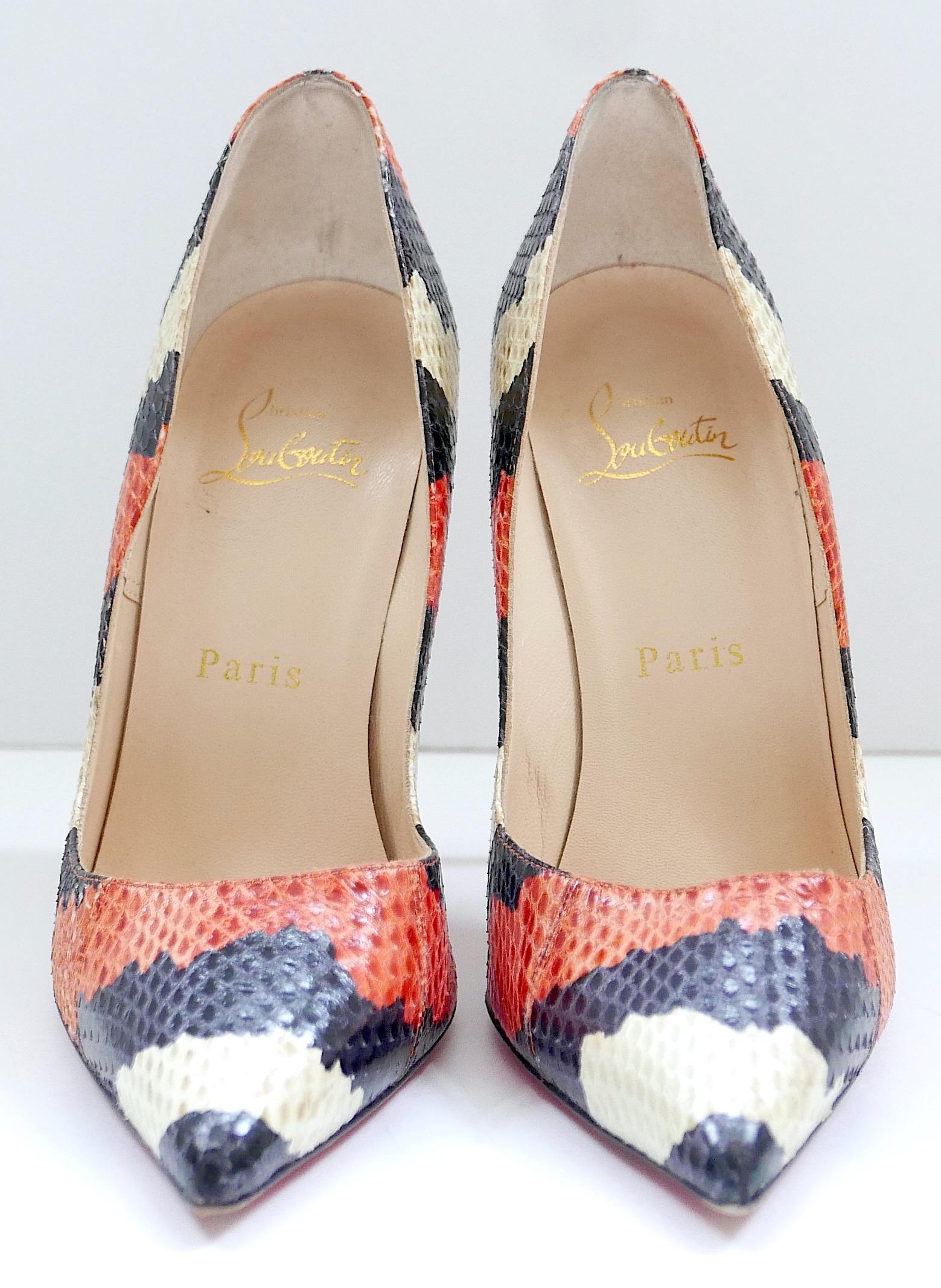 These are beautiful Christian Louboutin So Kate heels made of striped snakeskin. They have been worn once and come with one dustbag. Made from orange, beige, and black snakeskin, they feature pointed toes, stiletto heels, and the signature red