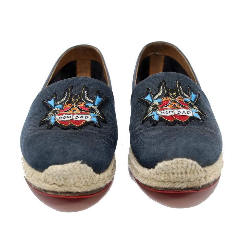 Christian Louboutin Sparrow Birds 'Mom & Dad' Tattoo Patch Espadrille Shoes

These youthful and fun Christian Louboutin Navy Blue Canvas Espadrille Flats can enhance any style. These highly sought after espadrilles from Louboutin are a must have for