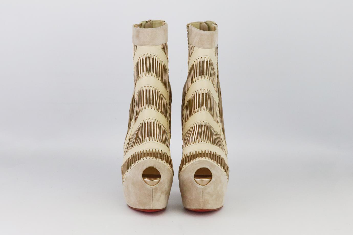 Christian Louboutin suede and leather platform ankle boots. Made from beige suede and leather with gold leather detail on platform sole and the brand’s iconic red sole. Beige and gold. Zip fastening at back. Does not come with box or dustbag. Size: