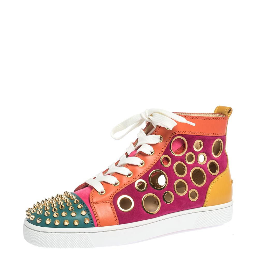 Fall in love with casual wear every time you step out in these sneakers from Christian Louboutin. They've been crafted from leather-suede and styled as a high top with an exterior breathtakingly lined with spikes and bubble cutouts. The sneakers