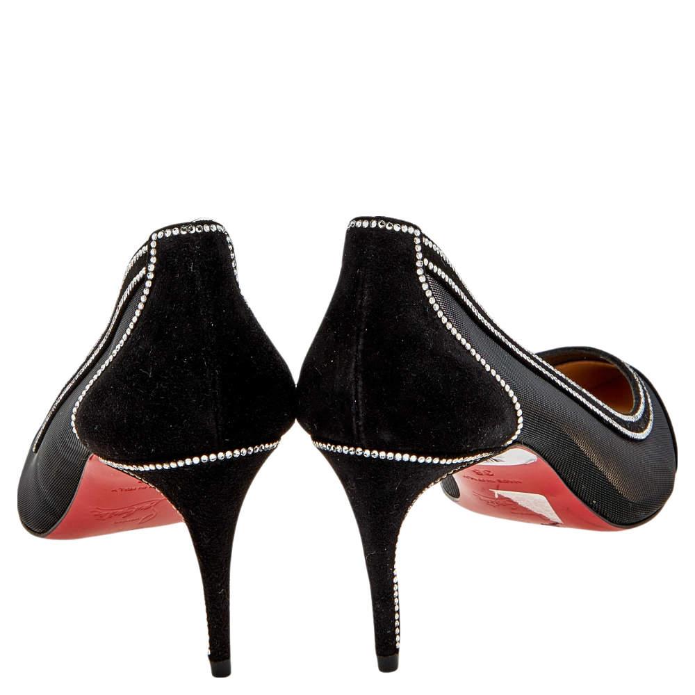 Put your best foot forward wearing these stunning pumps from Christian Louboutin. The black pair is made from suede and mesh and is adorned with crystal embellishments. Pointed toes and slender heels finish these gorgeous creations.


