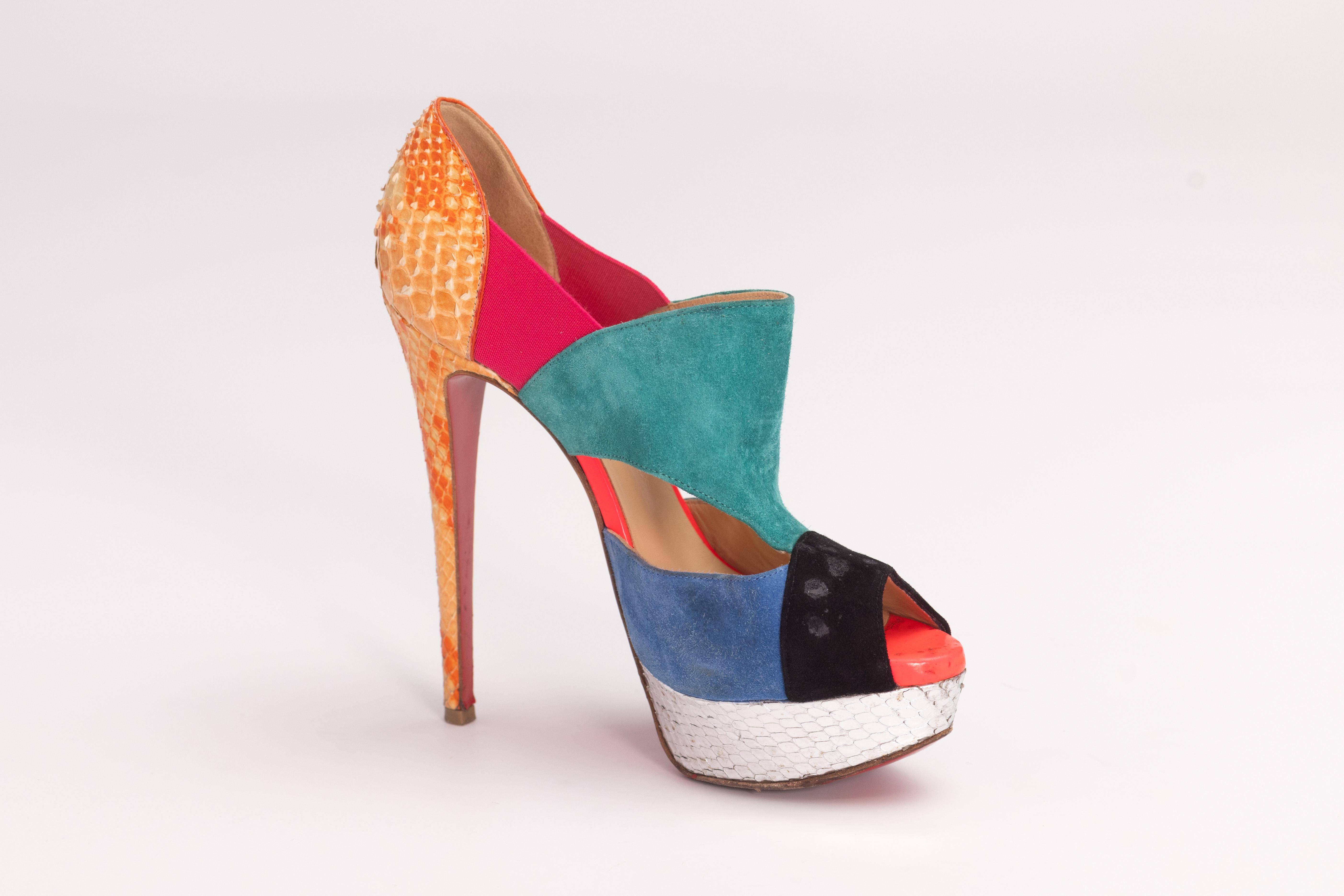 CHRISTIAN LOUBOUTIN MULTICOLOR SUEDE & PYTHON CUT OUT PLATFORM HEELS (EU 36)

Color: Multicoloured. Orange, pink, blue, turquoise. 
Material: Suede and Python Leather
Size: 36 EU
Heel Height: 1.4 mm / 5.5”
Platform Height: 25 mm / 1” 
Condition: