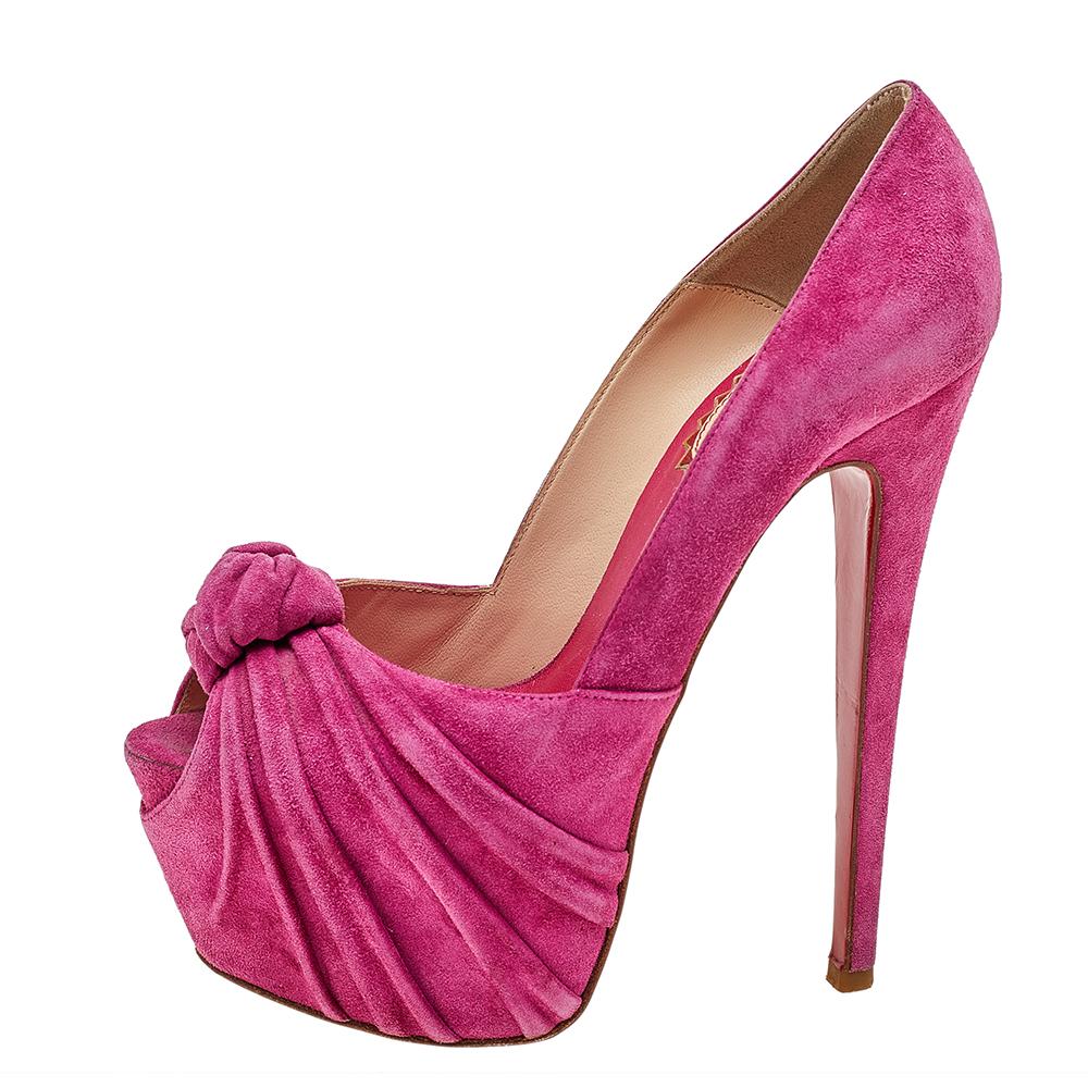 These ravishing pink Lady Gres pumps are a part of the 20th Anniversary Capsule Collection from the much-loved shoe label Christian Louboutin. They are crafted from suede into a peep-toe silhouette and styled with a drape and knot detailing on the