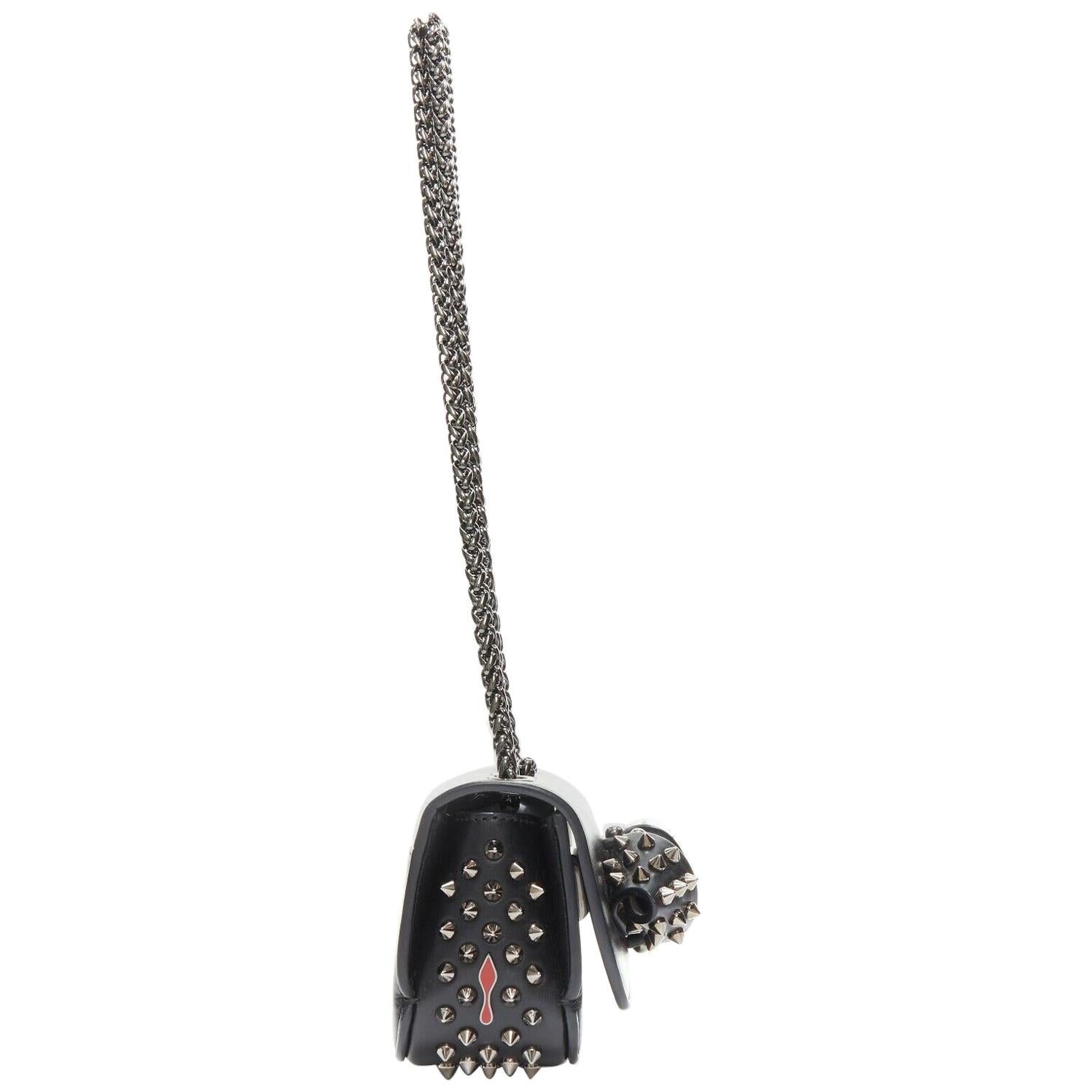 CHRISTIAN LOUBOUTIN Sweet Charity black studded spiked bow crossbody bag clutch
Designer: CHRISTIAN LOUBOUTIN
Model / Season: Sweet Charity
Material: Leather 
Color: Black
Pattern: Studded, spiked
Description: Mini cross-body clutch. Studded bow on