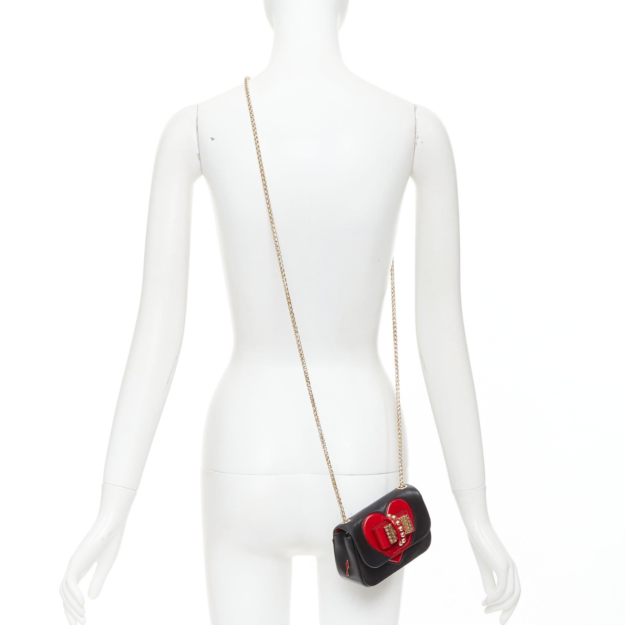 CHRISTIAN LOUBOUTIN Sweet Charity Heart black leather red patent mini crossbody bag
Reference: ECLO/A00177
Brand: Christian Louboutin
Model: Sweet Charity Heart
Material: Leather
Color: Black, Red
Pattern: Solid
Closure: Magnet
Lining: Red