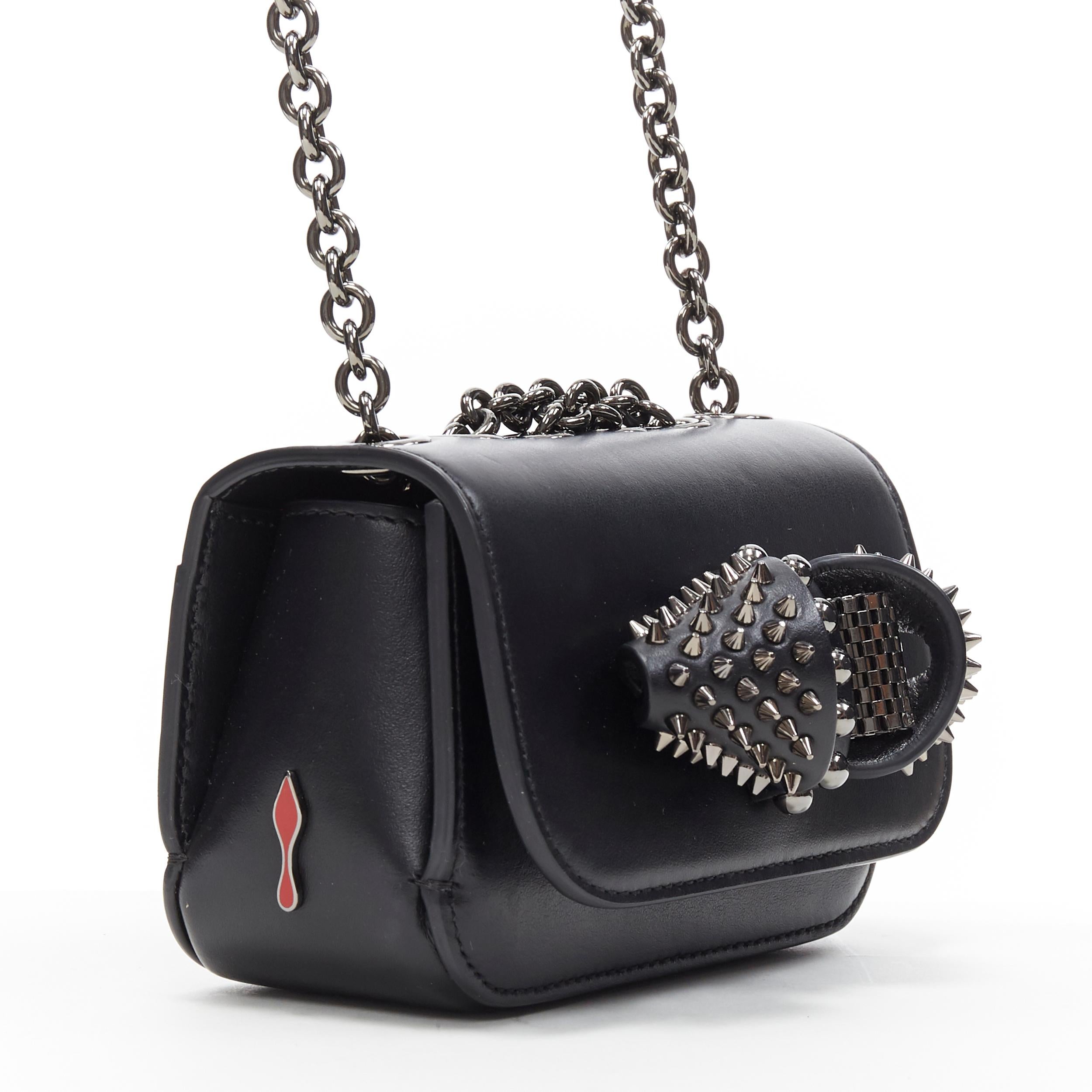 CHRISTIAN LOUBOUTIN Sweet Charity Mini black spike stud bow chain shoulder bag
Brand: Christian Louboutin
Designer: Christian Louboutin
Model Name / Style: Sweet Charity
Material: Leather
Color: Black
Pattern: Solid
Lining material: Leather
Extra