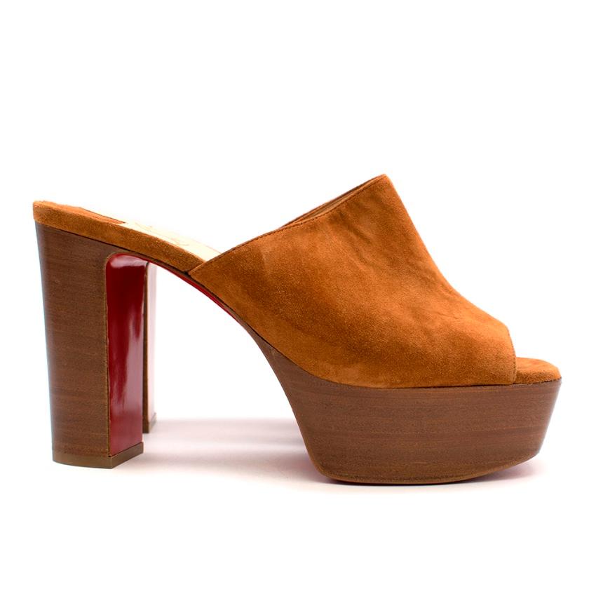 Christian Louboutin 100 suede platform mules

Christian Louboutin's peep-toe mules are designed in a warm hue that will compliment almost anything in your wardrobe. This pair is set on a chunky heel with a 40mm platform and features the label's