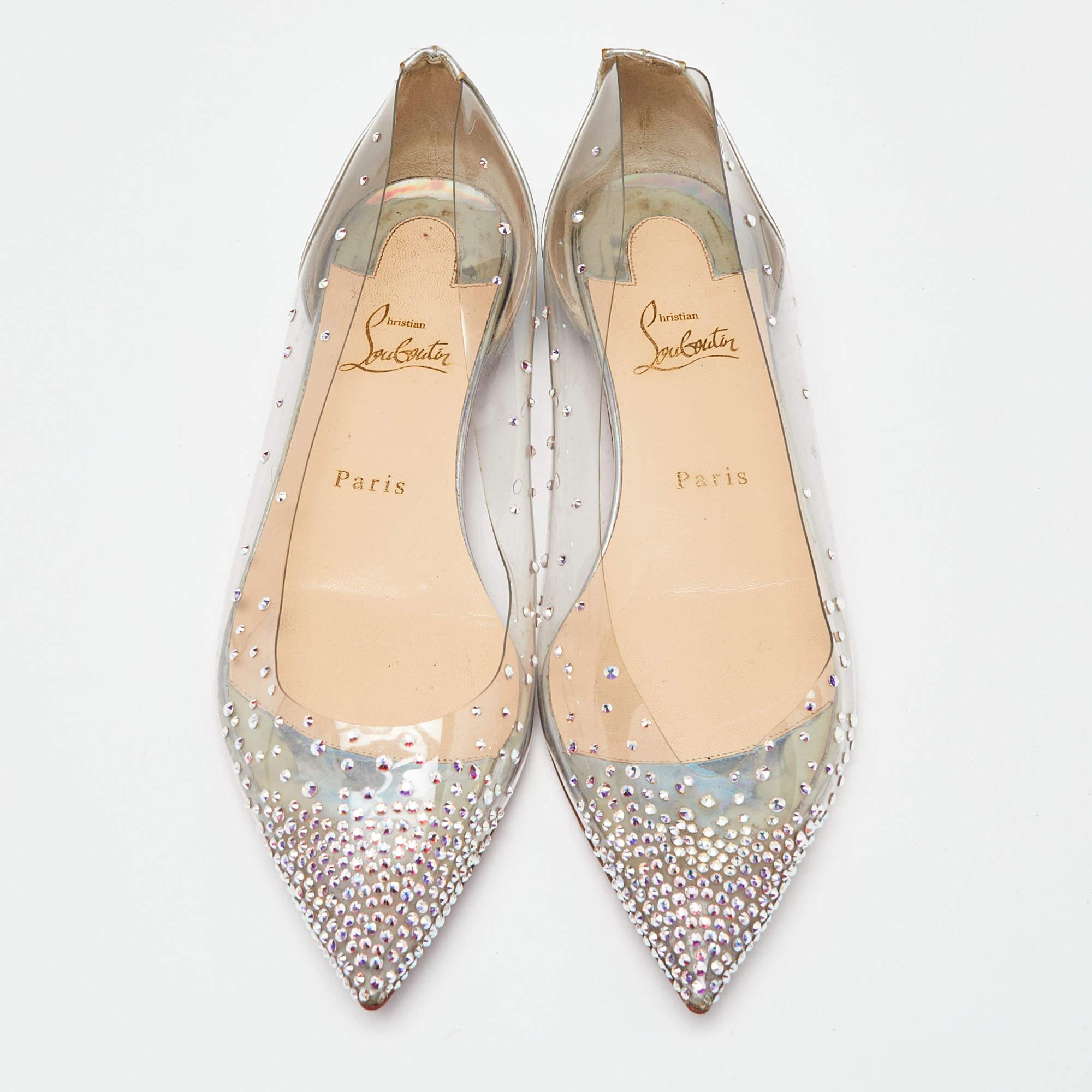 Be ready for constant attention and admirable gasps from your audience when you walk in these flats from Christian Louboutin. Crafted from transparent PVC and patent leather, they carry pointed toes, and crystals decorated all over. The pair is