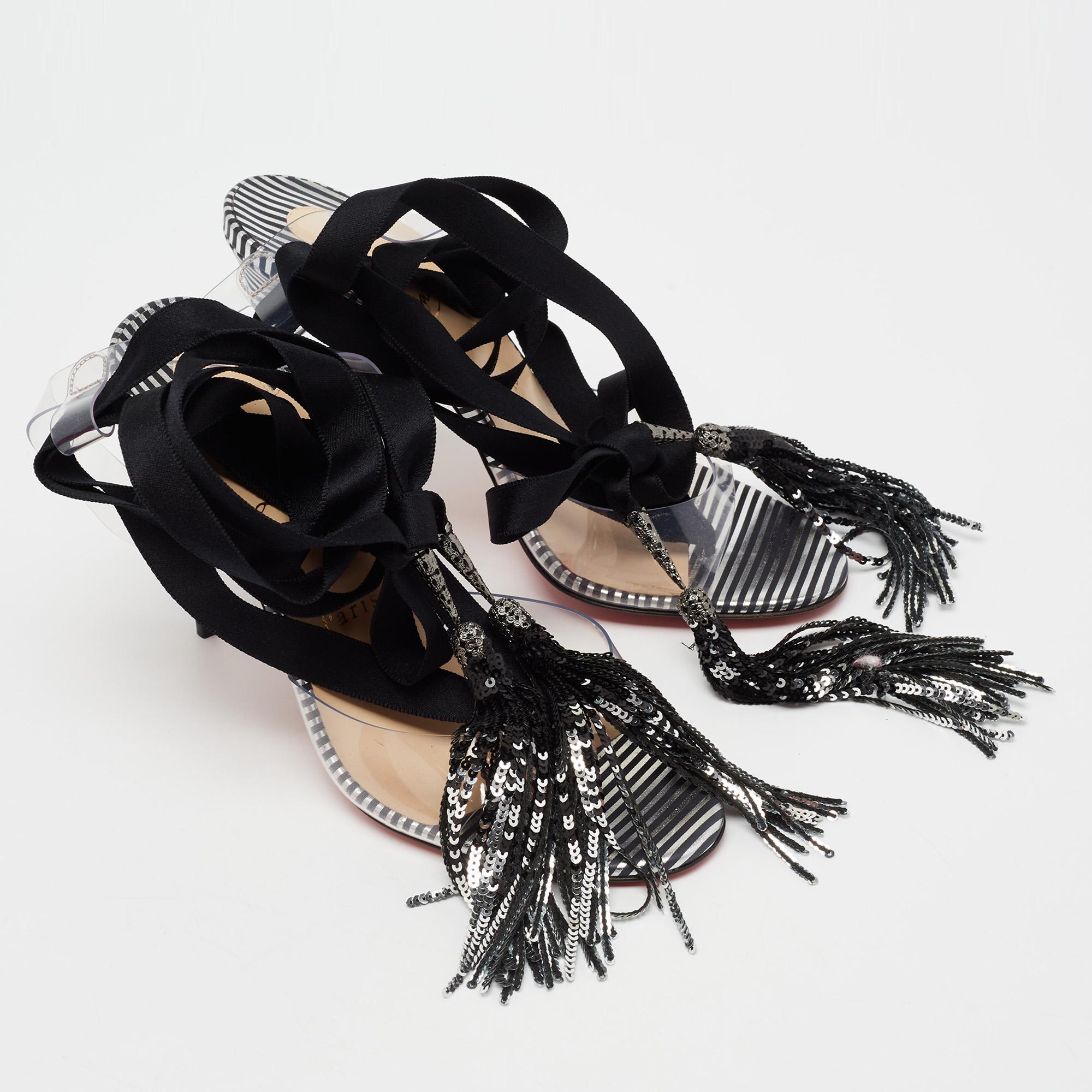 These quirky yet comfortable sandals from Christian Louboutin are truly head-turning. They are modern in their transparent PVC body and beyond stylish in their design. The statement sandals feature slender 11 cm heels, tie-up laces, and open-toes.