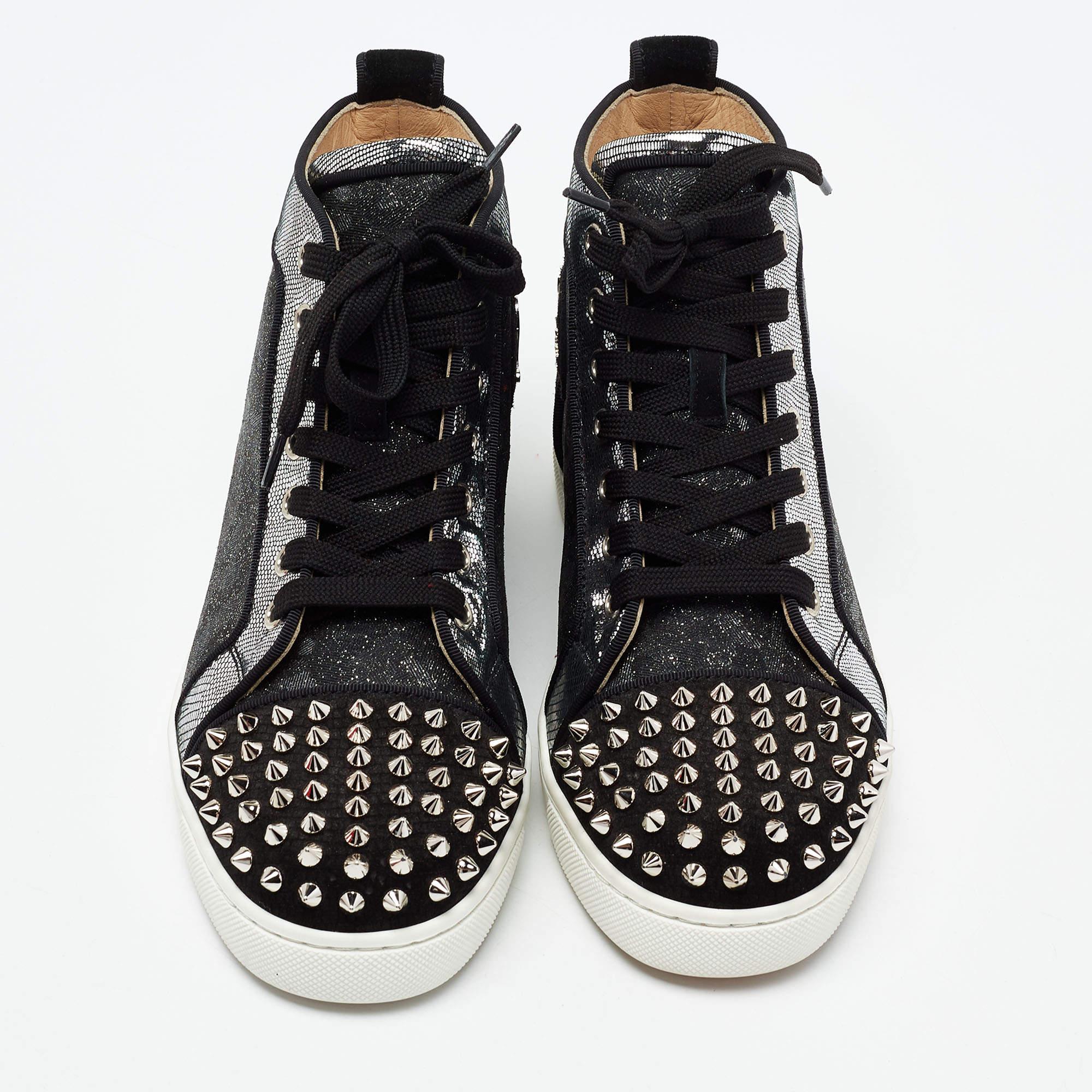 Feel great in your casual wear every time you step out in these sneakers from Christian Louboutin. They have been crafted from leather and suede and styled as a high top with cap-toes detailed with spikes. The sneakers carry round toes, lace-up