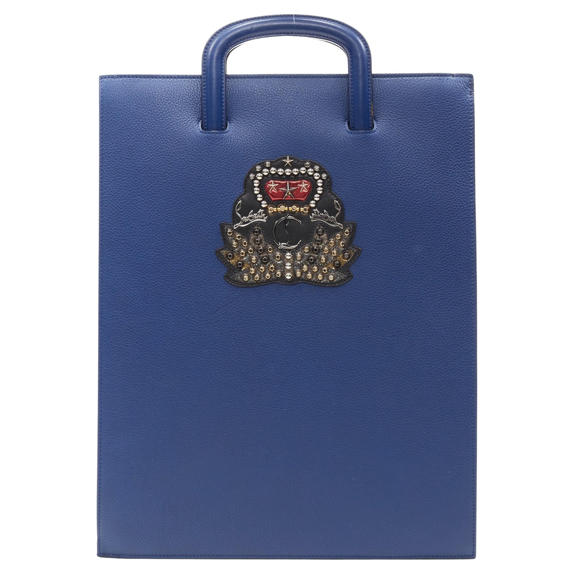 CHRISTIAN LOUBOUTIN Trictrac blue crest studded leather side zip portfolio bag For Sale