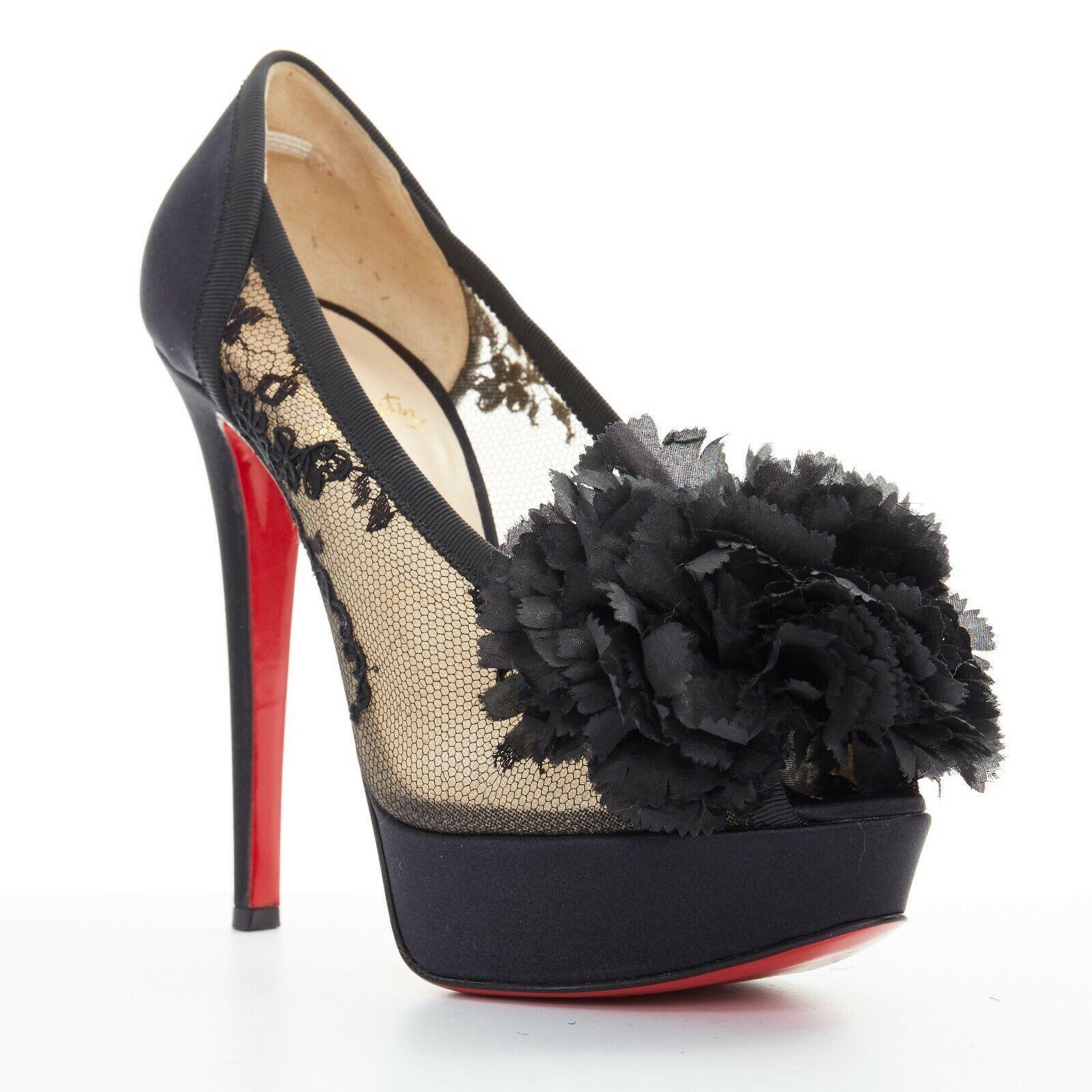 CHRISTIAN LOUBOUTIN Tsar 130 black embroidered lace flower satin platform EU37
CHRISTIAN LOUBOUTIN
Tsar 130. Ruffle flower brooch at toe. Peep toe. 
Mesh embroidered lace body. Black satin platform and heel. Tonal stitching. 
Padded tan leather