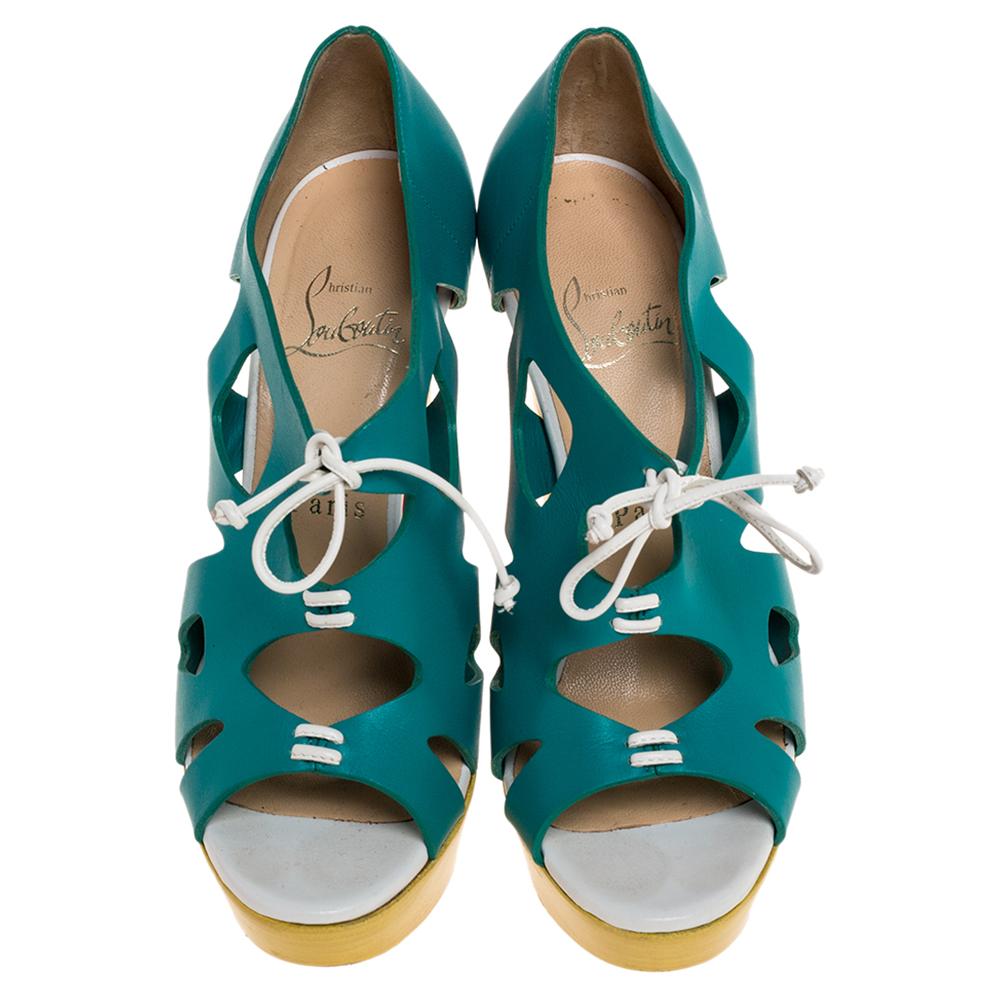 Elevate your style statement a notch higher with these pumps from Christain Louboutin! The turquoise & yellow pumps are crafted from cutout leather and feature open toes. They come equipped with comfortable leather-lined insoles, 13 cm towering
