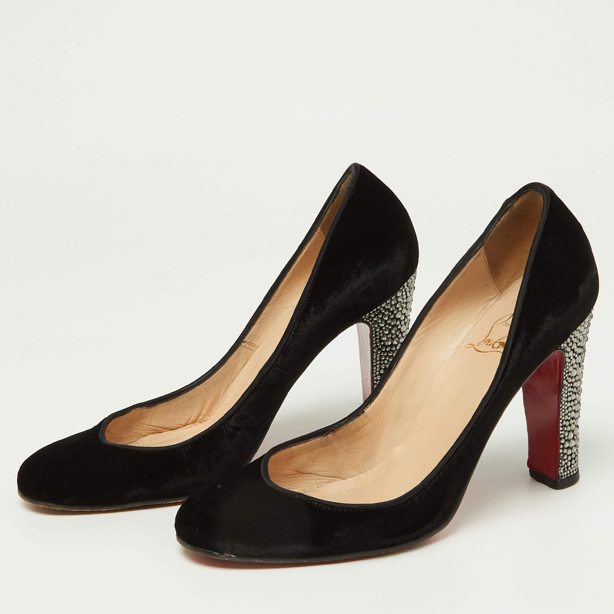 Every shoe collection needs a pair of pumps as enchanting as this one. These Christian Louboutin beauties are covered in velvet and styled with platforms crystal embellished 10cm heels and the signature red soles. Add these pumps to your collection