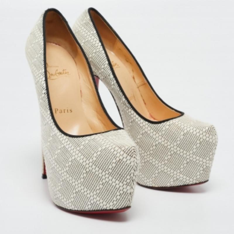 Take your love for Louboutins to new heights by adding this gorgeous pair to your collection. The stunning pumps are covered in raffia and elevated on platforms and 15 cm heels. The red soles add the signature finish that CL is loved for!