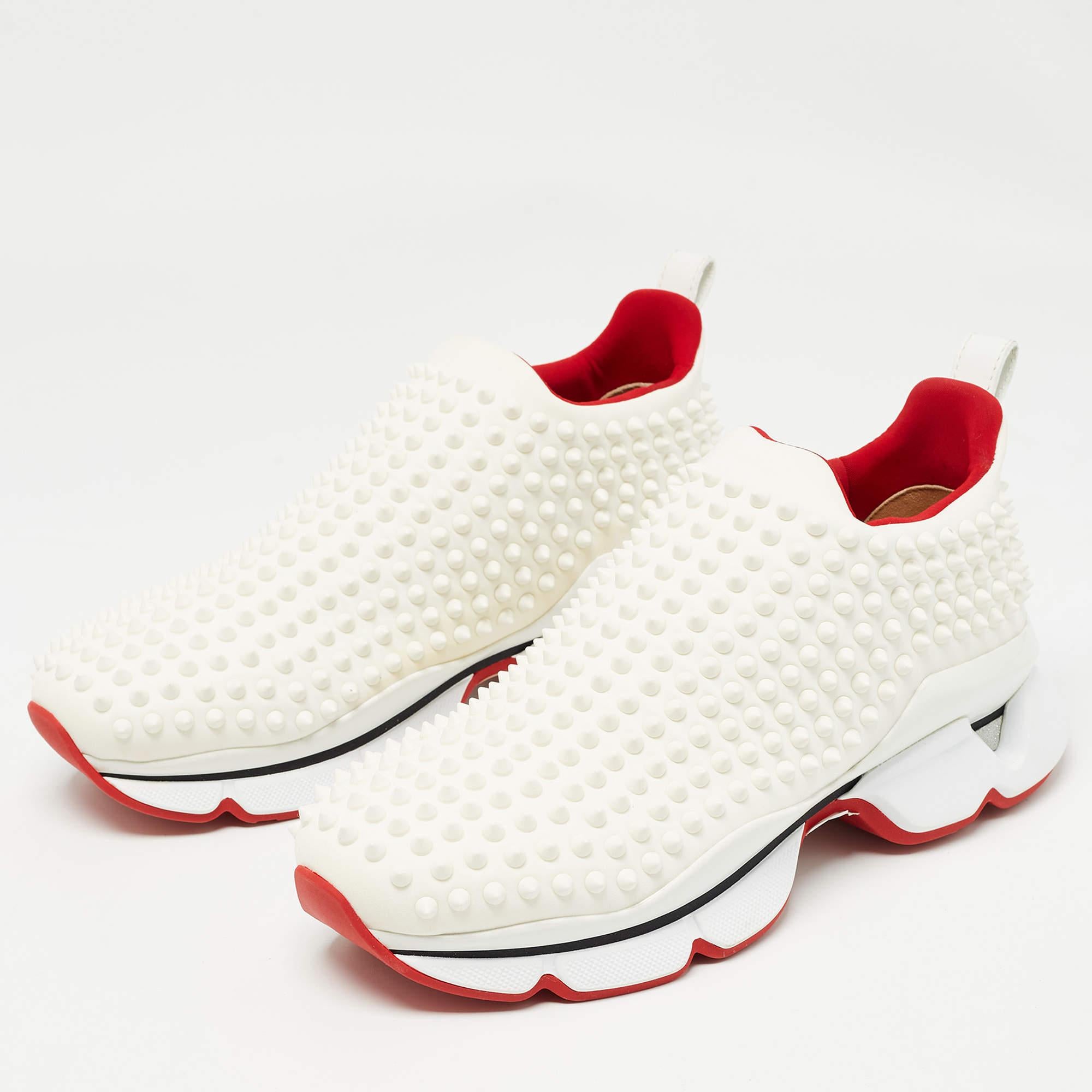 Inspired by the classic Louboutin heels, this pair of sneakers bring together effortless comfort and modish style. Featuring an eye-catching spike embellished design, in a sleek white shade, this pair of sneakers comes with a stylish sock slip-on