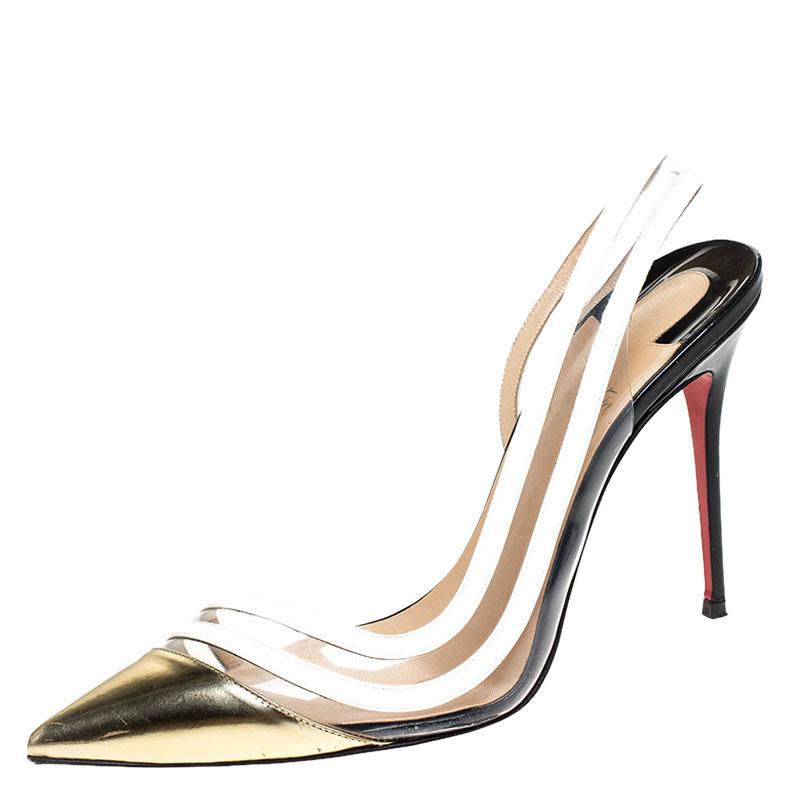 These Christian Louboutin pumps are accented with the famous Paralili design. The pair comes in metallic gold and white with pointed toes, stiletto heels and slingback straps. Crafted from leather and detailed with PVC panels, these pumps will
