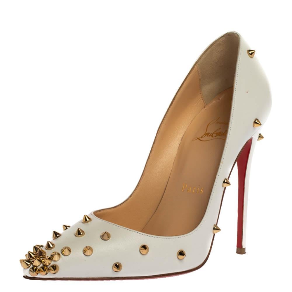Be ready for constant compliments when you walk in these pumps from Christian Louboutin. Crafted from white leather, they carry pointed toes and spikes decorated all over. The pair is complete with 11.5 cm heels, and the iconic red soles.

Includes: