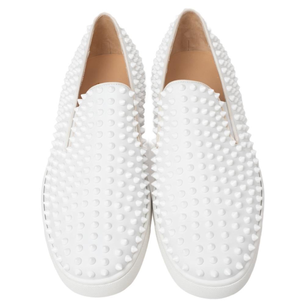 Make a bold statement in this pair of slip-ons from Christian Louboutin. This pair of spiked roller-boat sneakers exude easy glamour. The tortoiseshell pattern adds an edge to the look of the pair. The trademark red soles complete the package.

