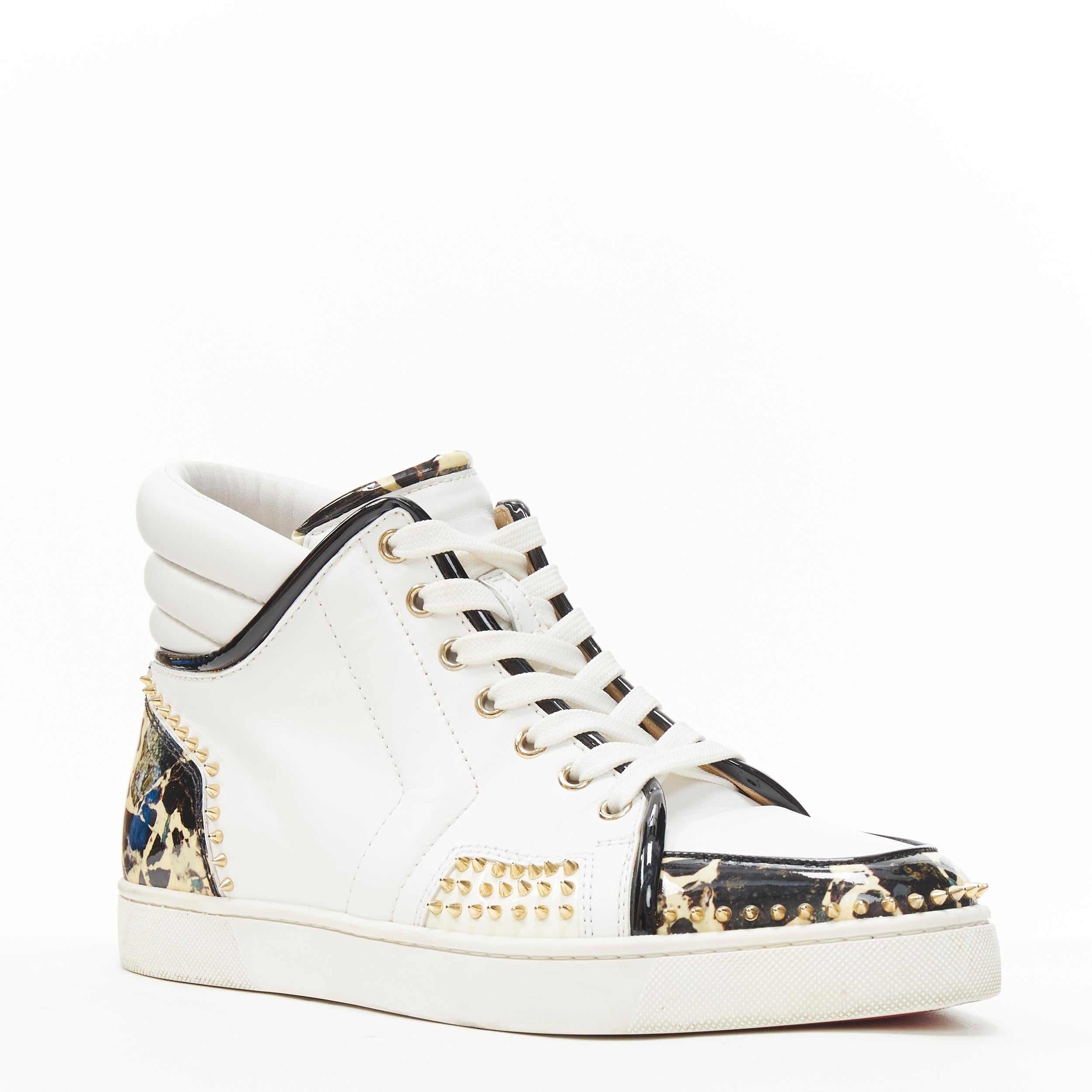 CHRISTIAN LOUBOUTIN white leather stone patent spike stud high top sneakers EU42 
Reference: TGAS/B01062 
Brand: Christian Louboutin 
Designer: Christian Louboutin 
Model: White patent spike stud high top 
Material: Leather 
Color: White 
Pattern: