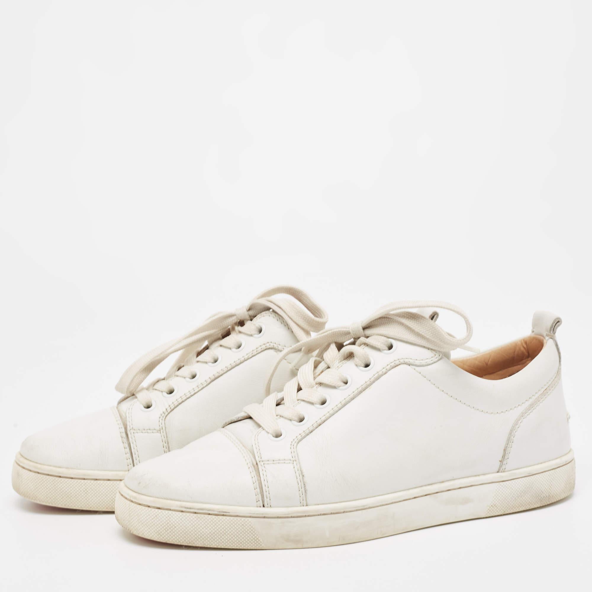 The rubber soles of these Christian Louboutin sneakers will lend you optimal grip while walking. Constructed from leather, they are styled with lace-up vamps, round toes, and durable insoles. The white shade of this pair will complement a variety of