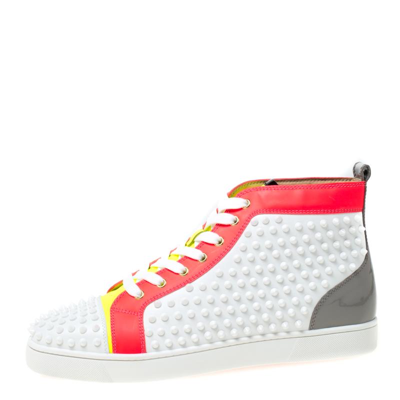 Feel great in your casual wear every time you step out in these sneakers from Christian Louboutin. They have been crafted from leather and styled as a high top with an exterior detailed with spikes. The sneakers carry round toes, lace-up vamps, and