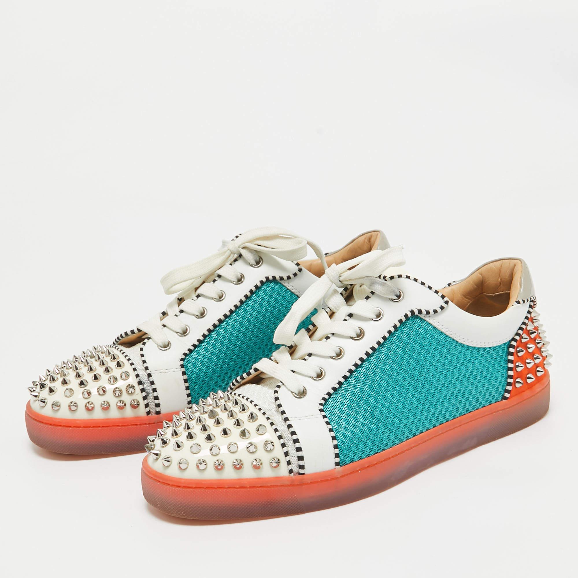 We see the signature spike details of Christian Louboutin well translated on these sneakers. They are crafted from mesh patent leather and feature spikes decorated on the cap toes. Lace ups a colorblock design leather insoles and red rubber soles