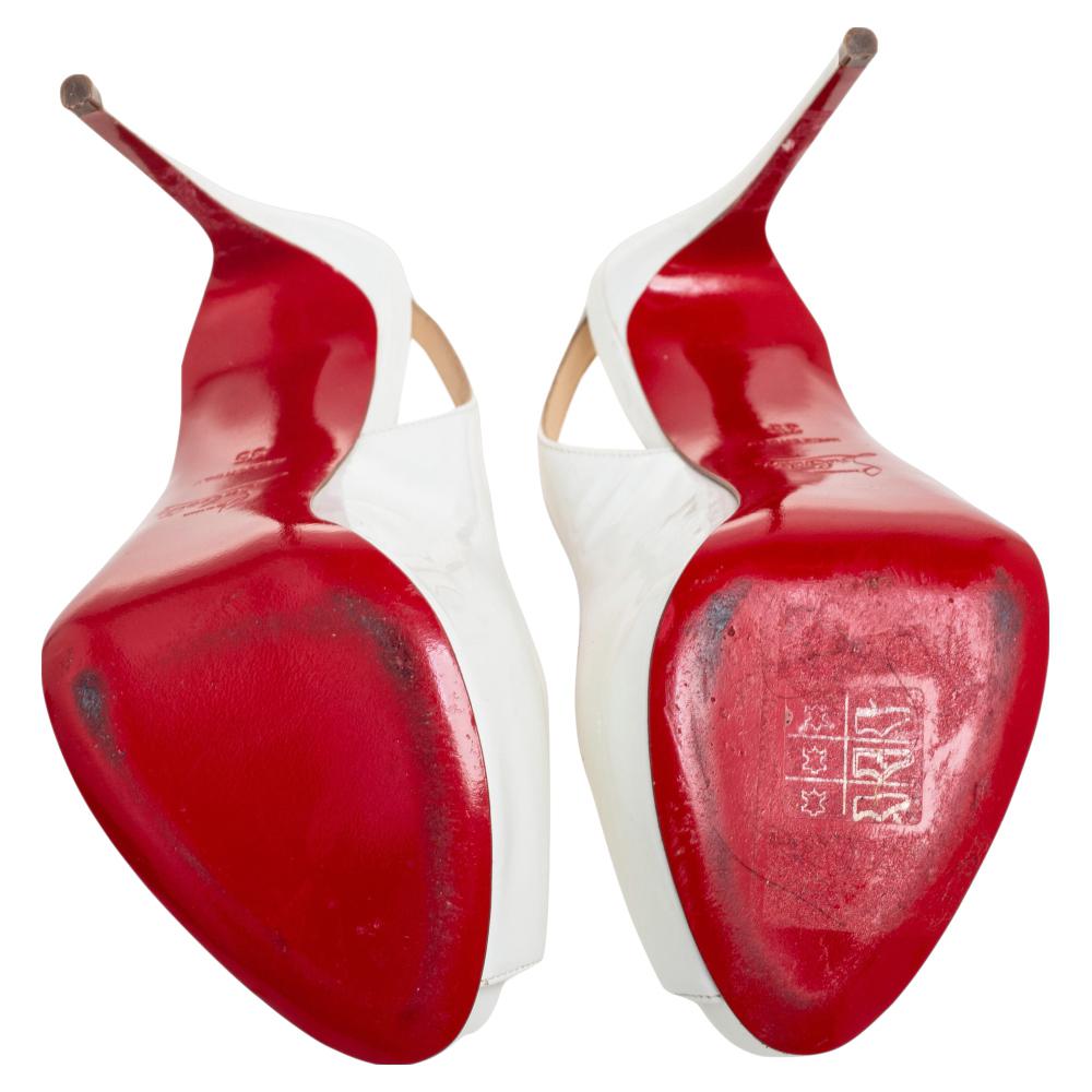 This pair from Christian Louboutin is well-built and exquisite in appeal. They have been crafted from glossy patent leather and styled with peep toes, slingbacks, and stiletto heels. They are complete with the red touch on the soles. Grab these