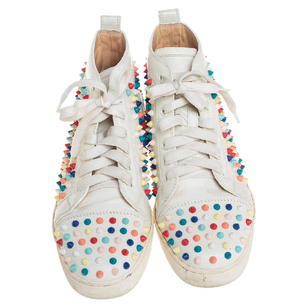 Christian Louboutin might be known for elegant pumps and sandals, but these sneakers just add more to that list. They've been crafted from white leather and styled as a high top with an exterior wonderfully decorated with multicolored spikes. The