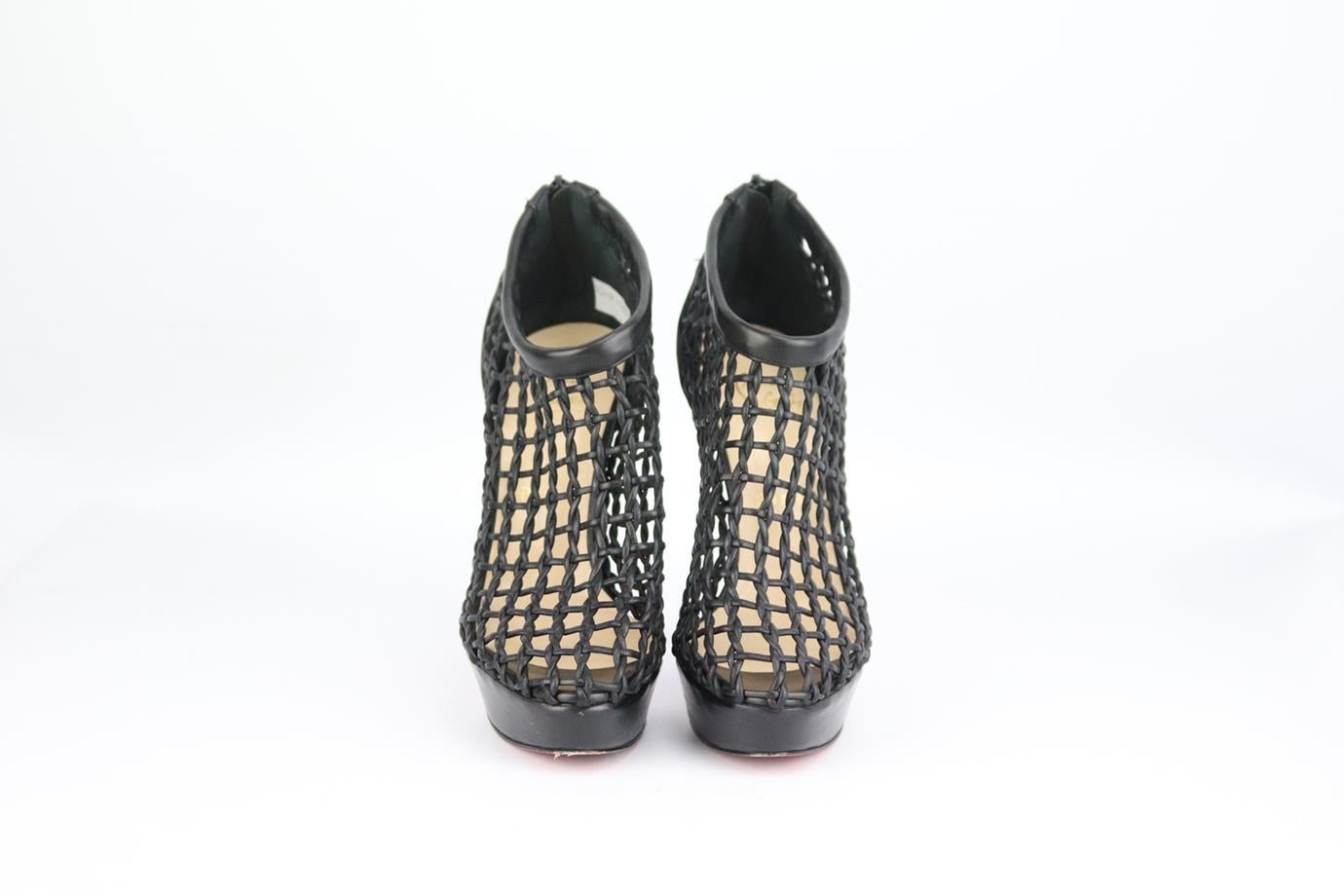 Christian Louboutin woven leather platform ankle boots. Made from black leather with woven cutout detail and set on the brand’s iconic red sole. Black. Zip fastening at back. Does not come with box or dustbag. Size: EU 38 (UK 5, US 8). Insole: 9.3