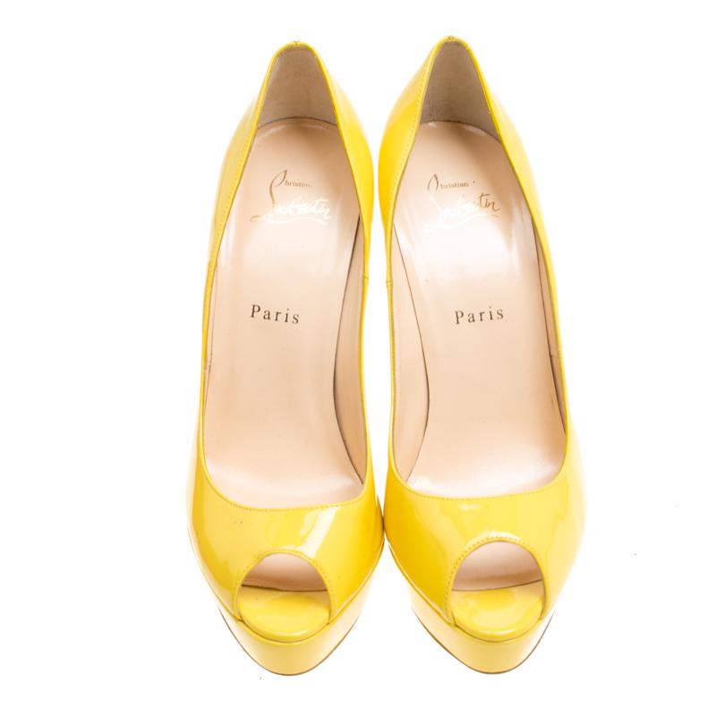 These vibrant yellow pumps from Christian Louboutin are all you need to create your own sunshine! They are crafted from patent leather and feature a peep-toe silhouette. Comfortable leather lined insoles, 13.5 cm heels, solid platforms and the