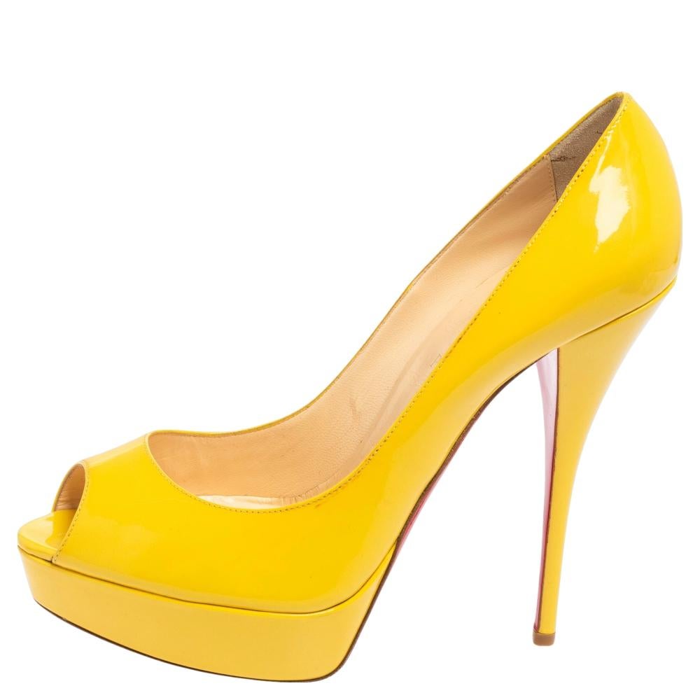Stand out from the crowd with this gorgeous pair of Louboutins that exude high fashion with class! Crafted from patent leather, this is a creation from their Lady Peep collection. They feature a classic yellow shade with peep toes and a glossy