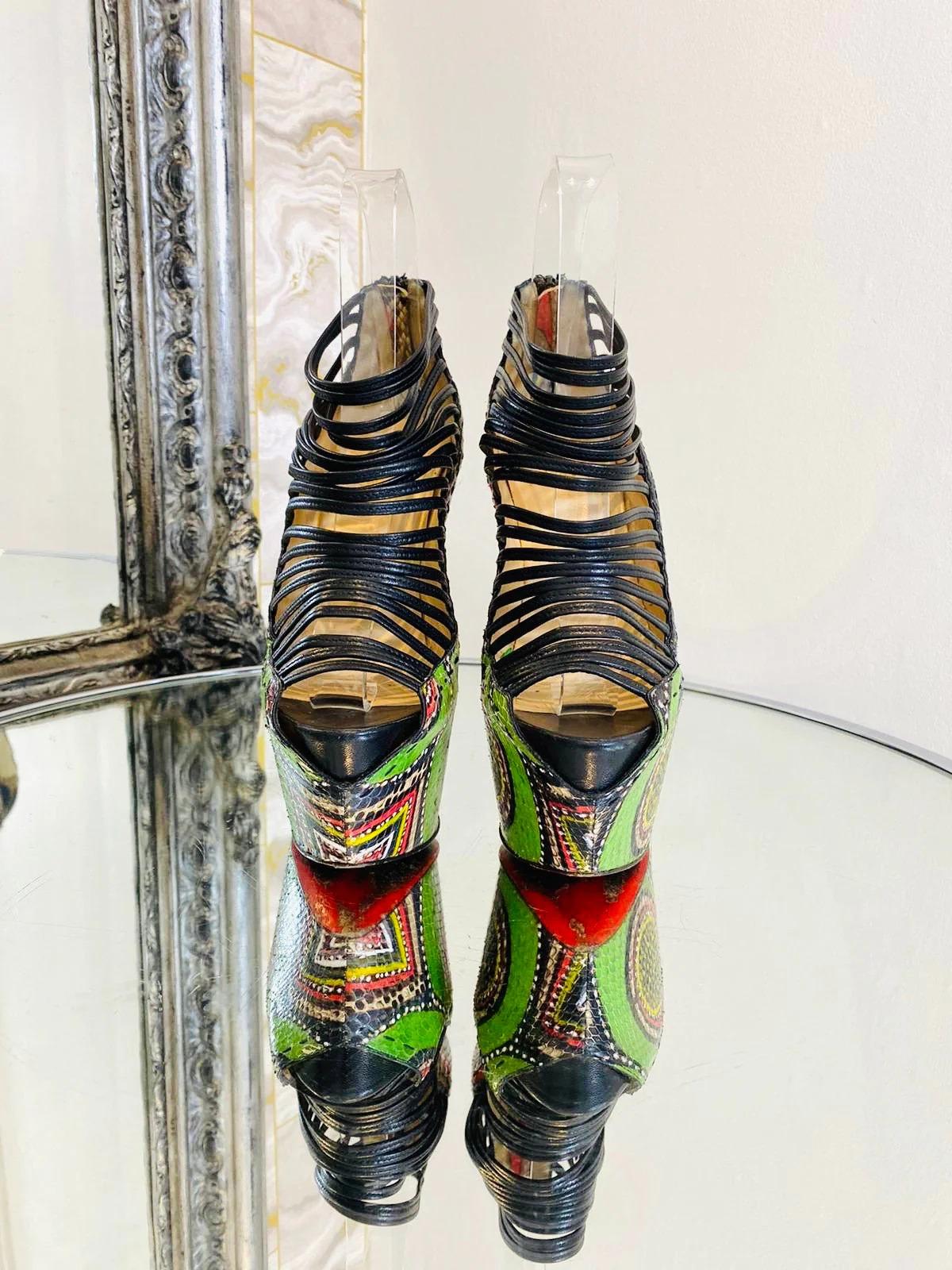Christian Louboutin Zoulou Exotic Skin Platform Heels

Multicoloured Python skin platform with Pony skin heels and black leather strappy uppers.

Additional information:
Size – 37
Composition - Pony Skin, Python Skin, Leather
Condition – Very
