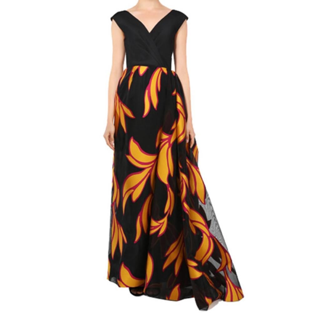 Look like a Spanish seniorita in this fabulous Christian Siriano dress from his SS15 collection. Its black off-shoulder and V-neck design is coupled with a fiery skirt made from sheer black fabric, printed with orange designs and red outlines. This