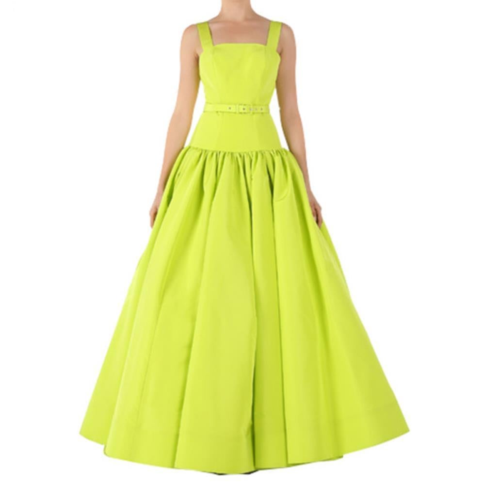 Become the center of the evening with this Christian Siriano gown. Released with his SS15 collection, its striking lime green color will not leave you unnoticed. The classic neckline and shoulder straps keep it classy, coupled with a belt at the