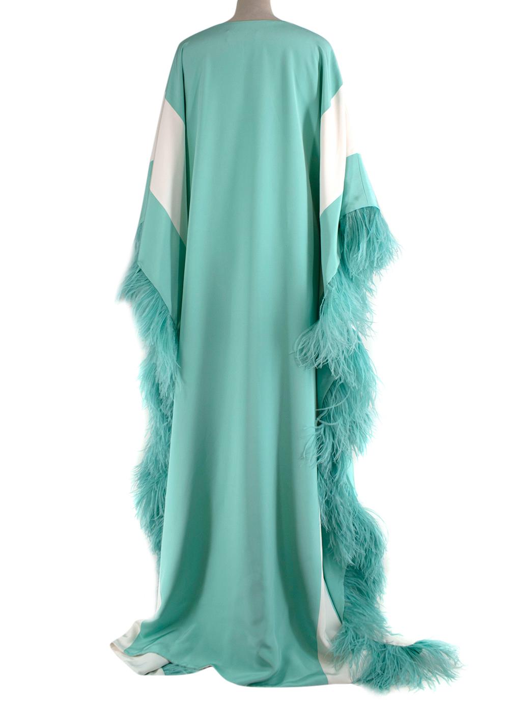 Christian Siriano V Neck Caftan with Feathers

- Oversized V neck caftan with large draped sleeves in a bright turquoise hue 
- Diagonal white stripes along the sides and arms 
- Ostrich feather trimming along the side seams and cuffs  
- Silk crepe