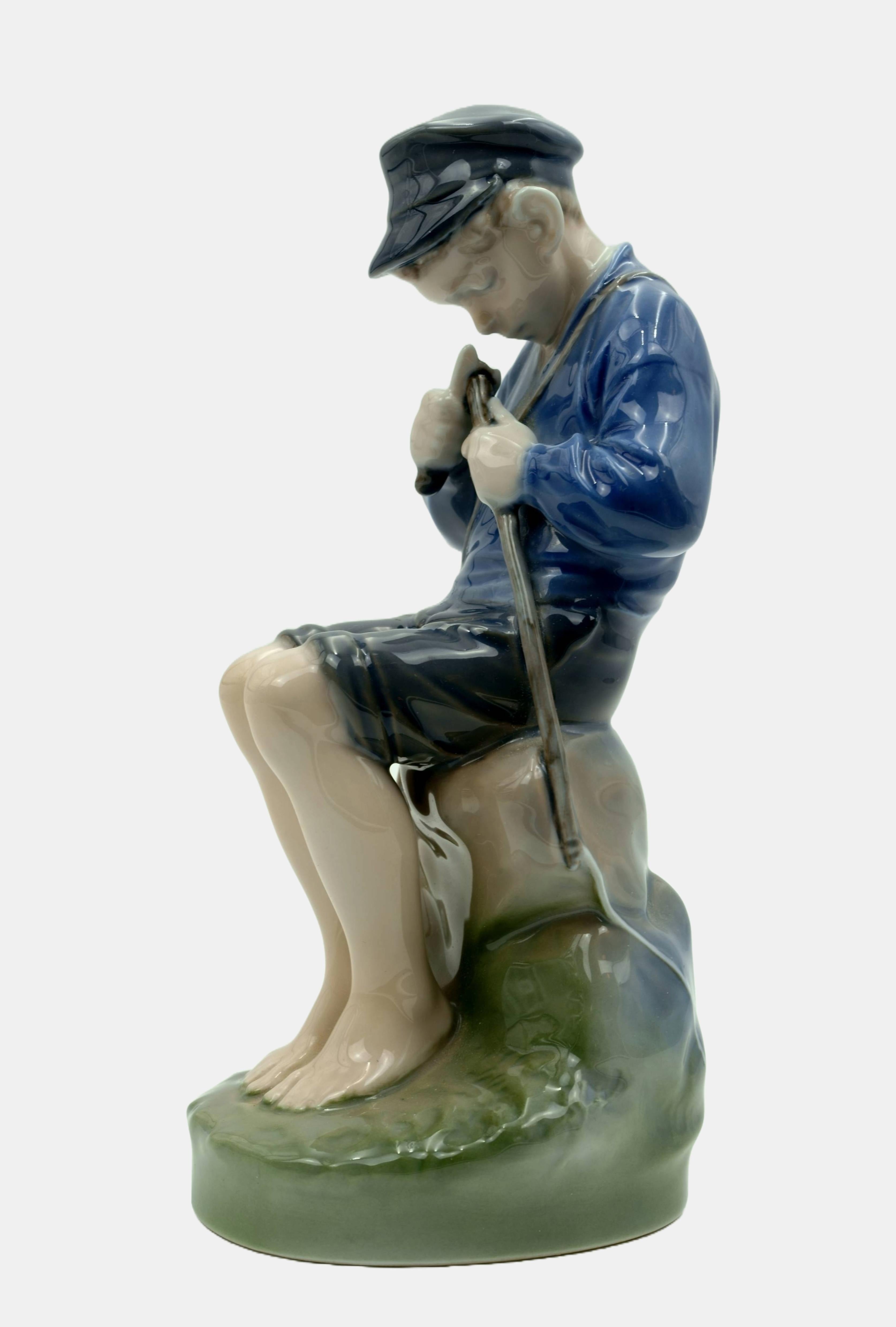 Royal Copenhagen Figure Carving Boy / - Immersed in concentration - - Sculpture by Christian Thomsen