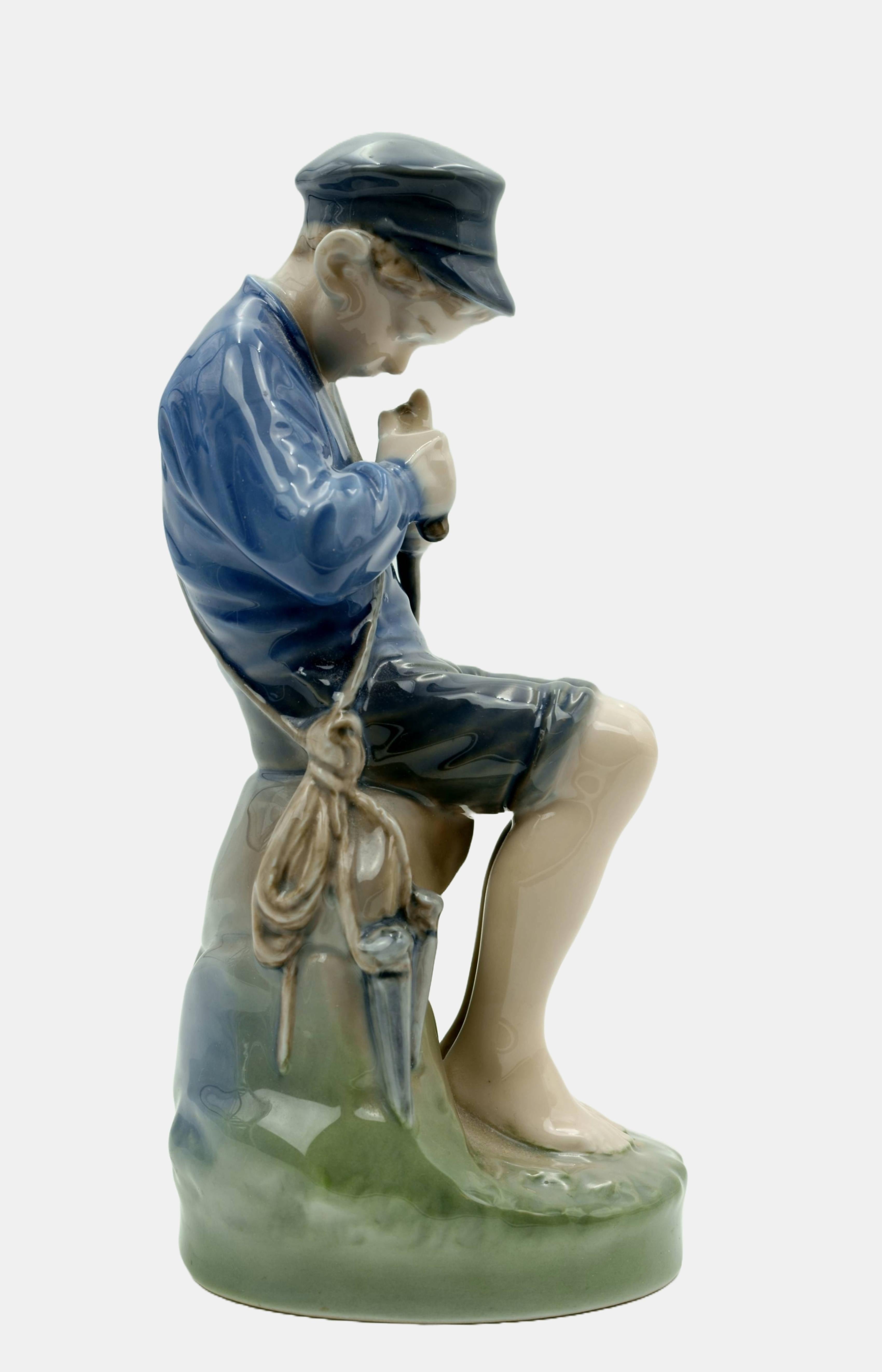 Royal Copenhagen Figure Carving Boy / - Immersed in concentration - - Gray Figurative Sculpture by Christian Thomsen