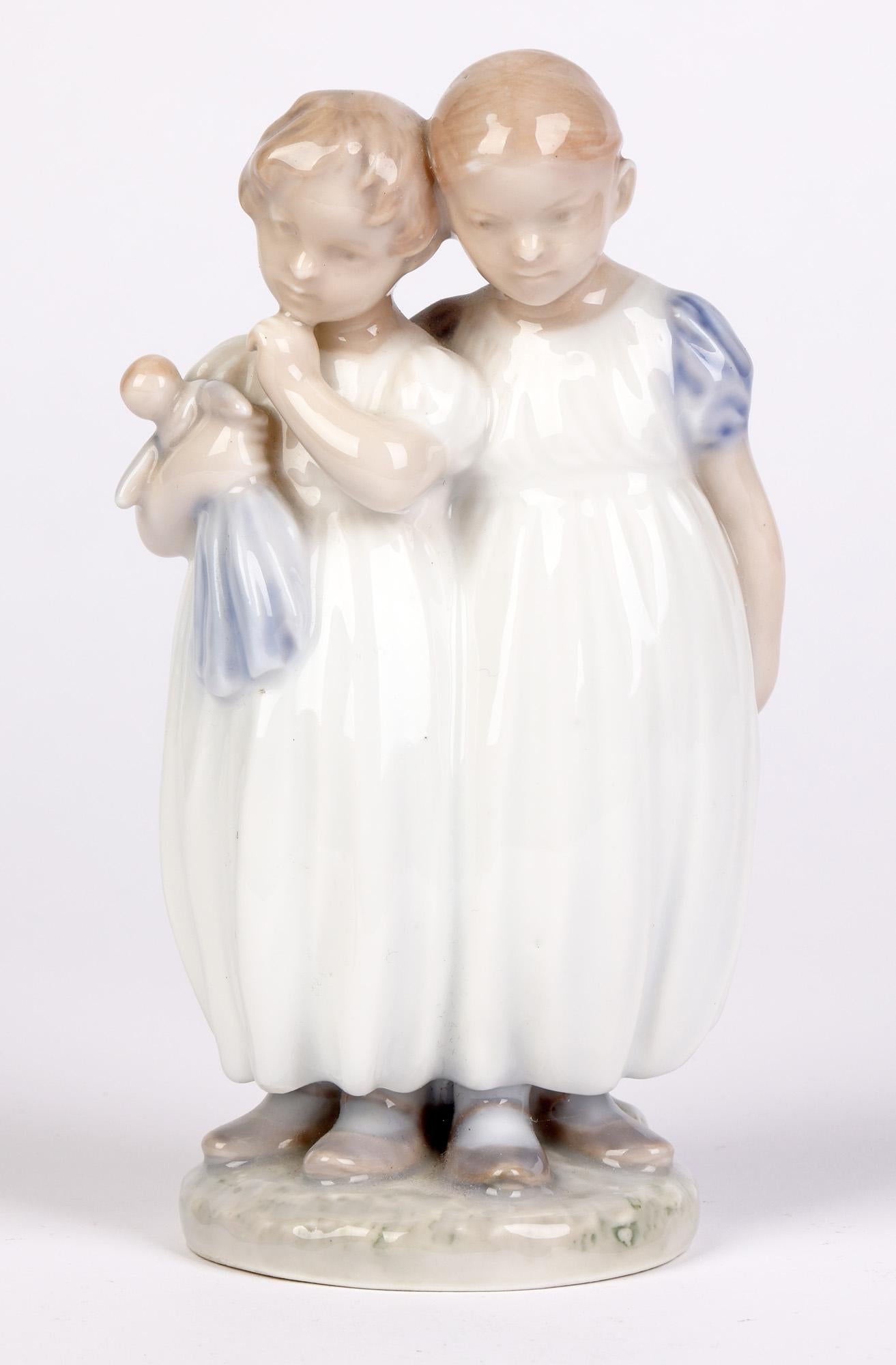 Porcelain Christian Thomsen Royal Copenhagen Two Girls and Doll Figure For Sale