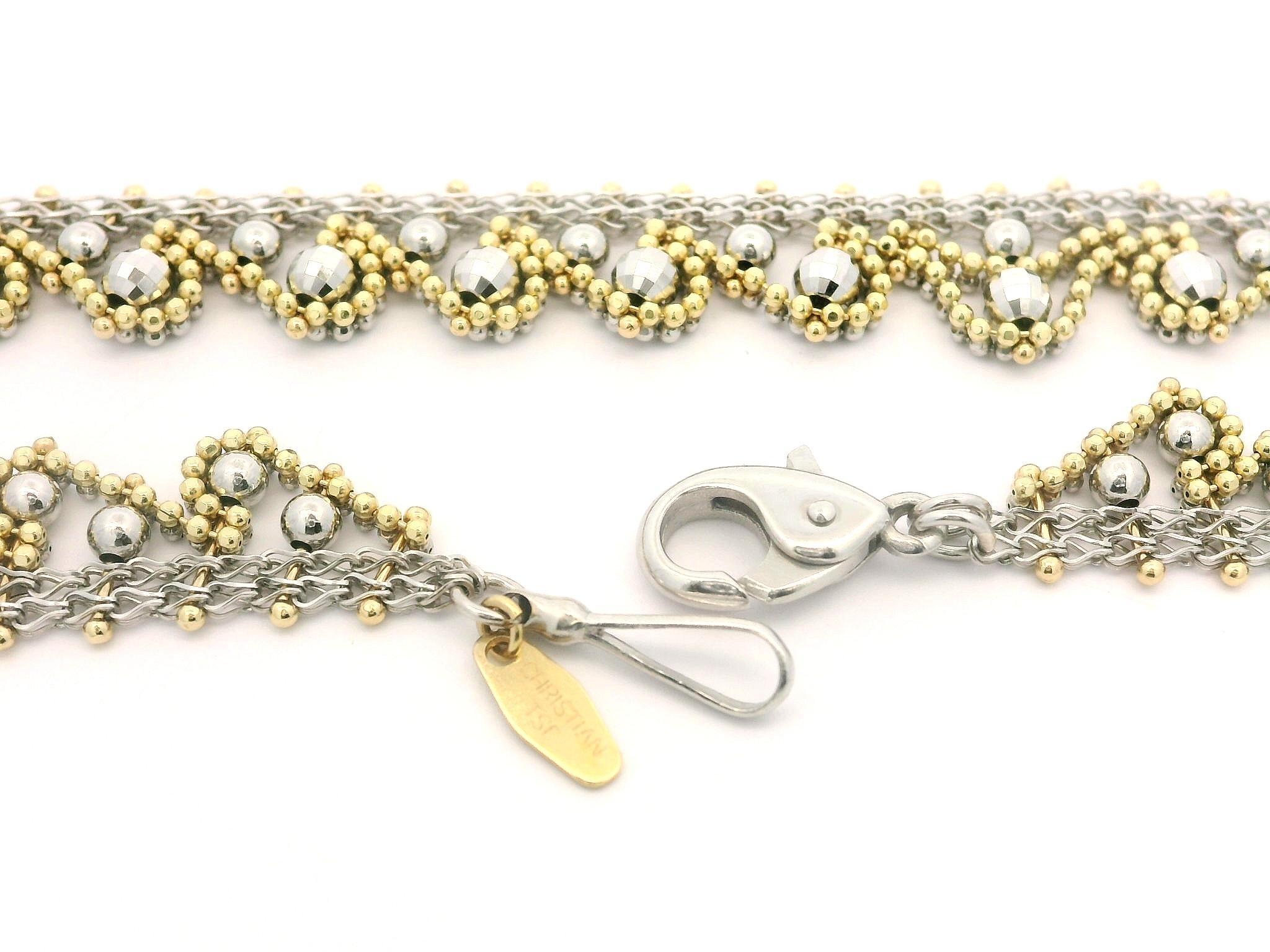 Material: Solid 18k Yellow Gold w/ Platinum
Weight: 24.02 Grams
Chain Type: Mesh Link w/ Textured Bead Drops
Chain Length: 16 inches
Chain Width: 8.5mm (0.33