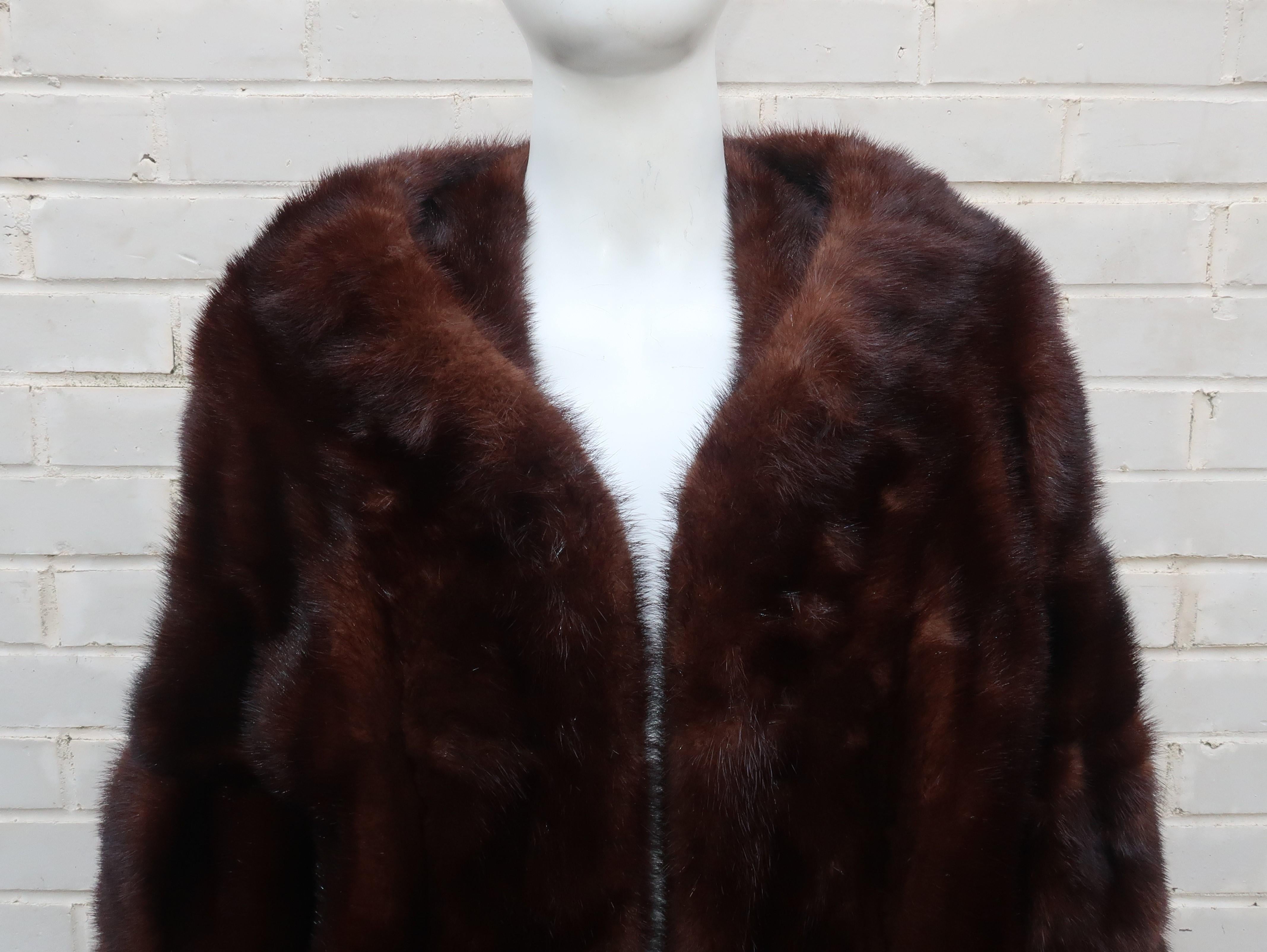 This clever restyled design by the famous New York furrier, Christie Brothers, appears to be a 1960's update to a classic 1950's stole.  The unique silhouette starts with a lovely portrait neckline which drops down to bell shaped 3/4 sleeves and a