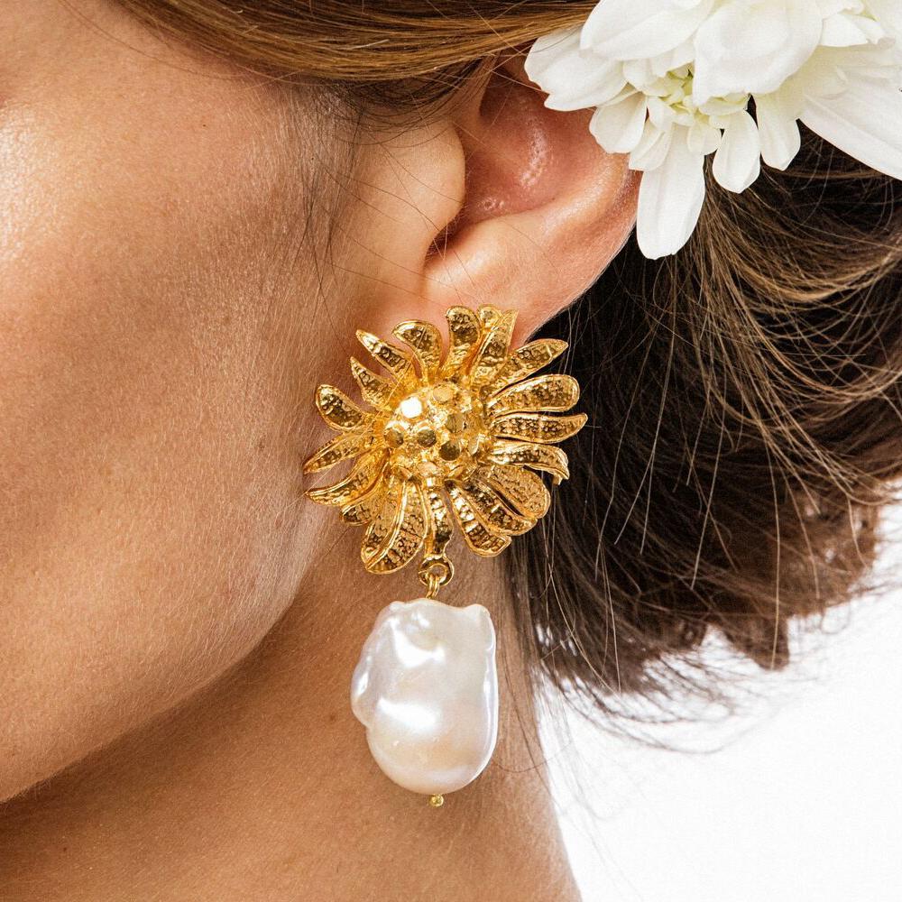 The Antonella Earrings are handcrafted in Europe. Created with 24k gold-plated brass, the Antonella Earrings feature with freshwater pearls. Perfect for special occasion, bridal, bridal parties and garden weddings. 

Please note each and every pair