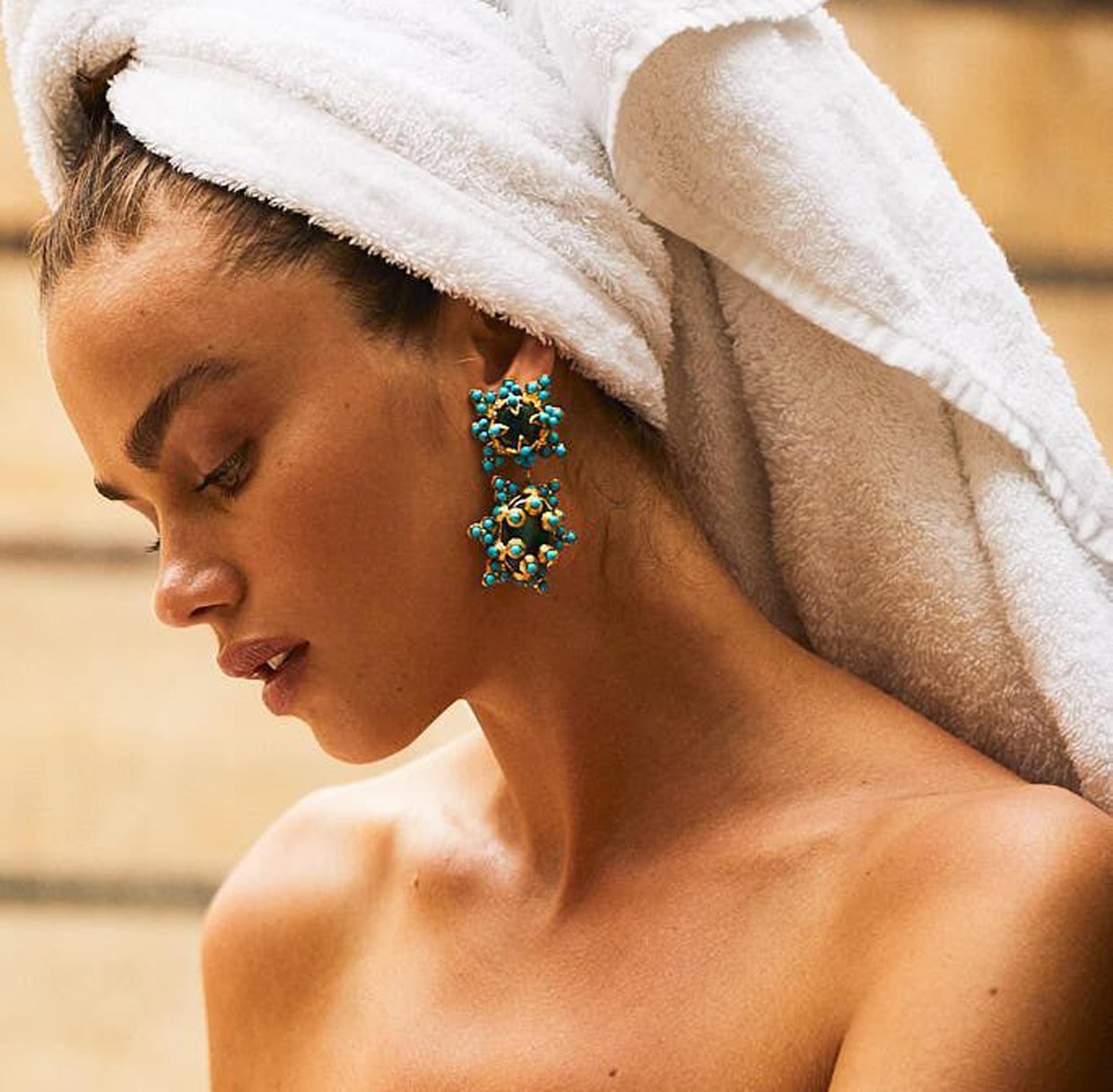 The Lucia Earrings are handcrafted in Europe. Created with 24k gold-plated brass, the Lucia Earrings feature malachite with acrylic turquoise beads. Perfect for special occasions, garden weddings, bridal and cocktail parties. 

Please note each and