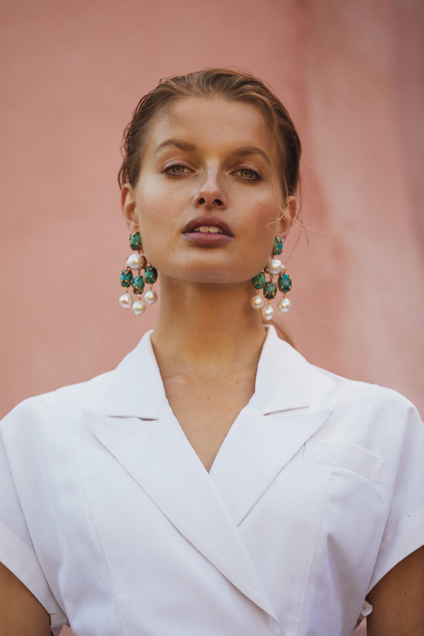 The Vittoria Earrings are handcrafted in Europe. Created with 24k gold-plated brass, the Vittoria Earrings feature with chrysocolla and freshwater baroque pearls. Perfect for special occasions, bridal, cocktail parties and black-tie events. 

Please