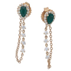 Christina, boucles d'oreilles en or jaune 14 carats reliées par une chaîne avec émeraudes naturelles