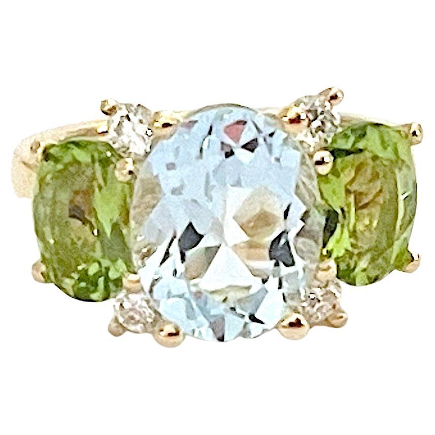 Christina Addison Bespoke 18kt Yellow Gold Small GUM DROP™ Ring with BlueTopaz (approx 3.5cts) and two Citrine (approx 5 cts total) and Diamonds approximately~ 0.25cts

This beautiful ring measures ~ 1  