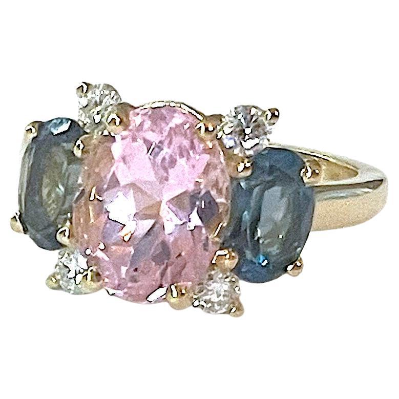Christina Addison Bespoke 18kt Yellow Gold Small GUM DROP™ Ring with Bright Pink Topaz (approx 3.5cts) and two London Blue Topaz( approx 5 cts total) and Diamonds approximately~ 0.25cts

This beautiful ring measures ~ 1  