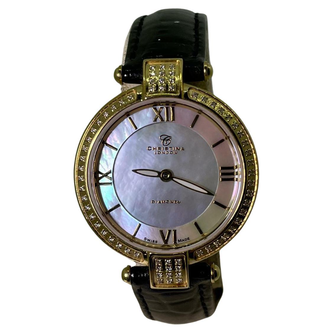 Fabulously designed by Christina Hembo - a renowned Danish jewellery & watch designer 
from CHRISTINA Design London, 

this wristwatch is centering an 18K gold plated 27mm circular case,
with bezel & lugs adorned with round brilliant cut diamonds